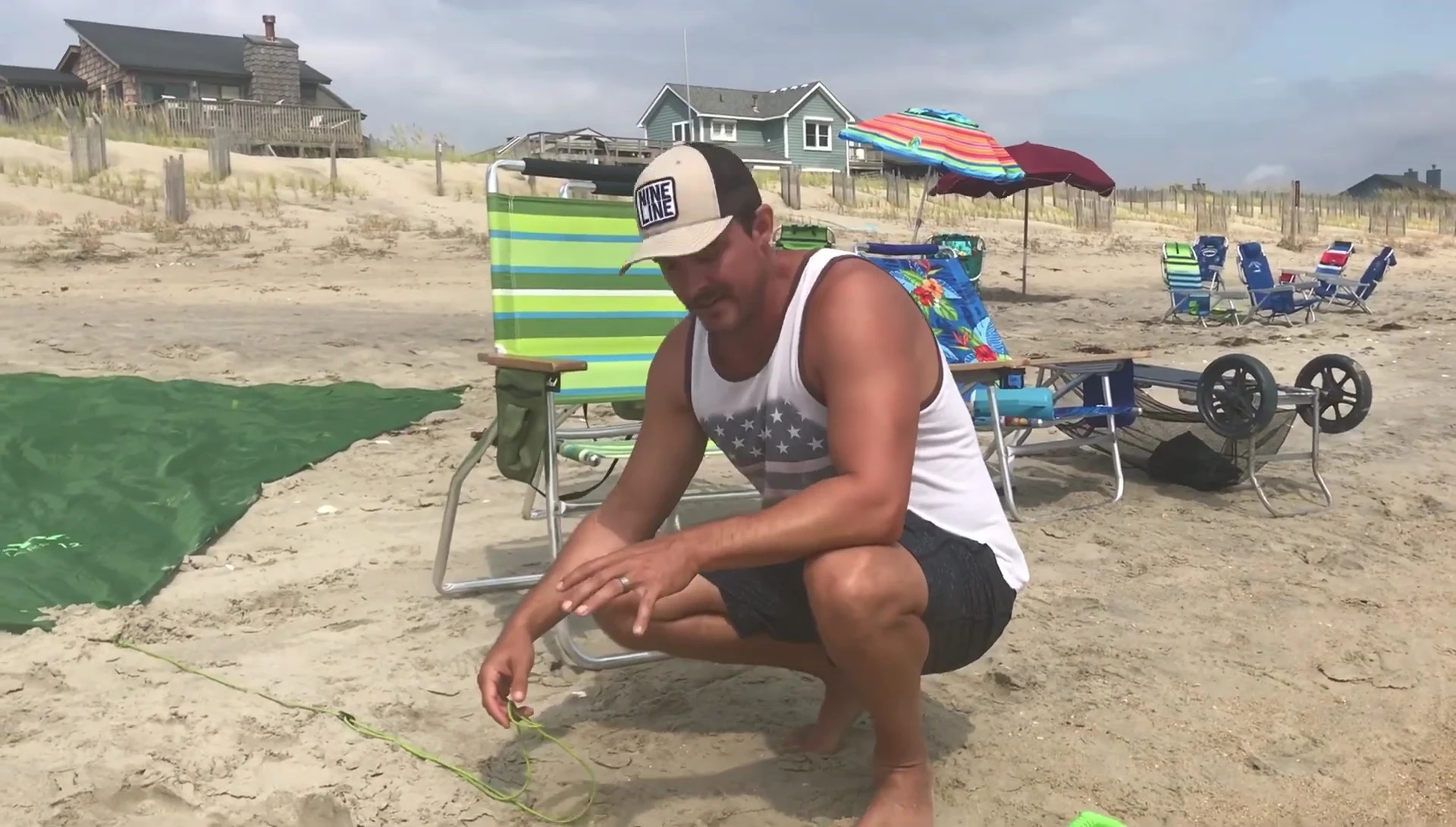 Burying sand anchors