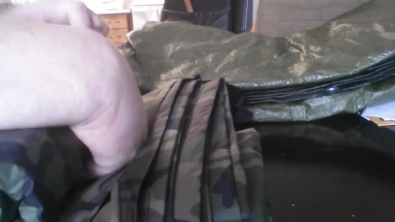 The reviewer preparing to set up the tarp