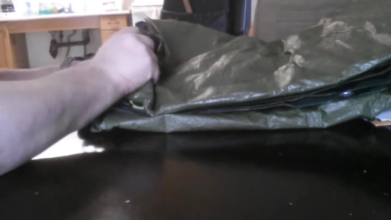 Close-up of the old tarp flapping in the wind
