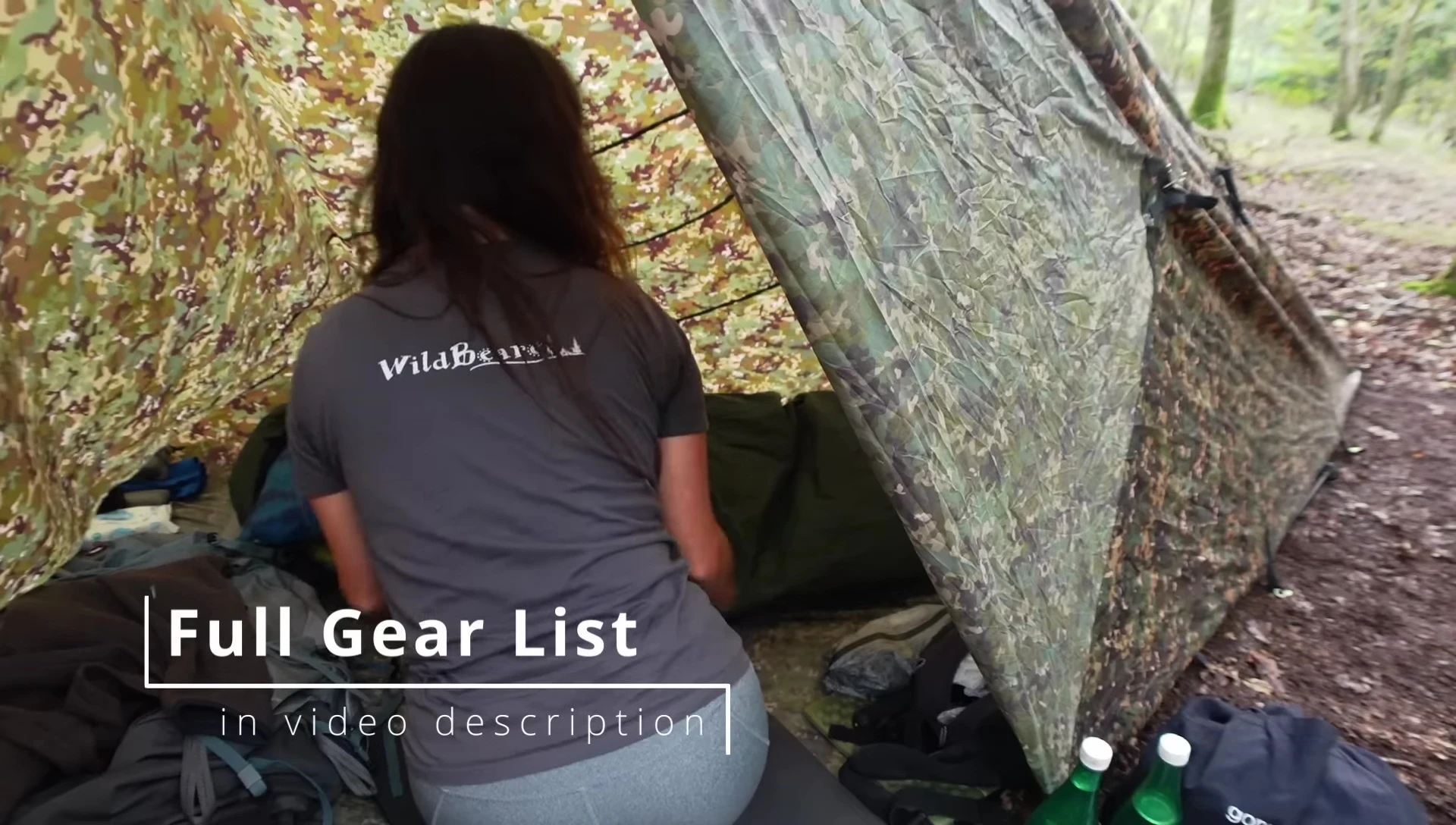 Gear organized inside the fully enclosed tarp shelter.