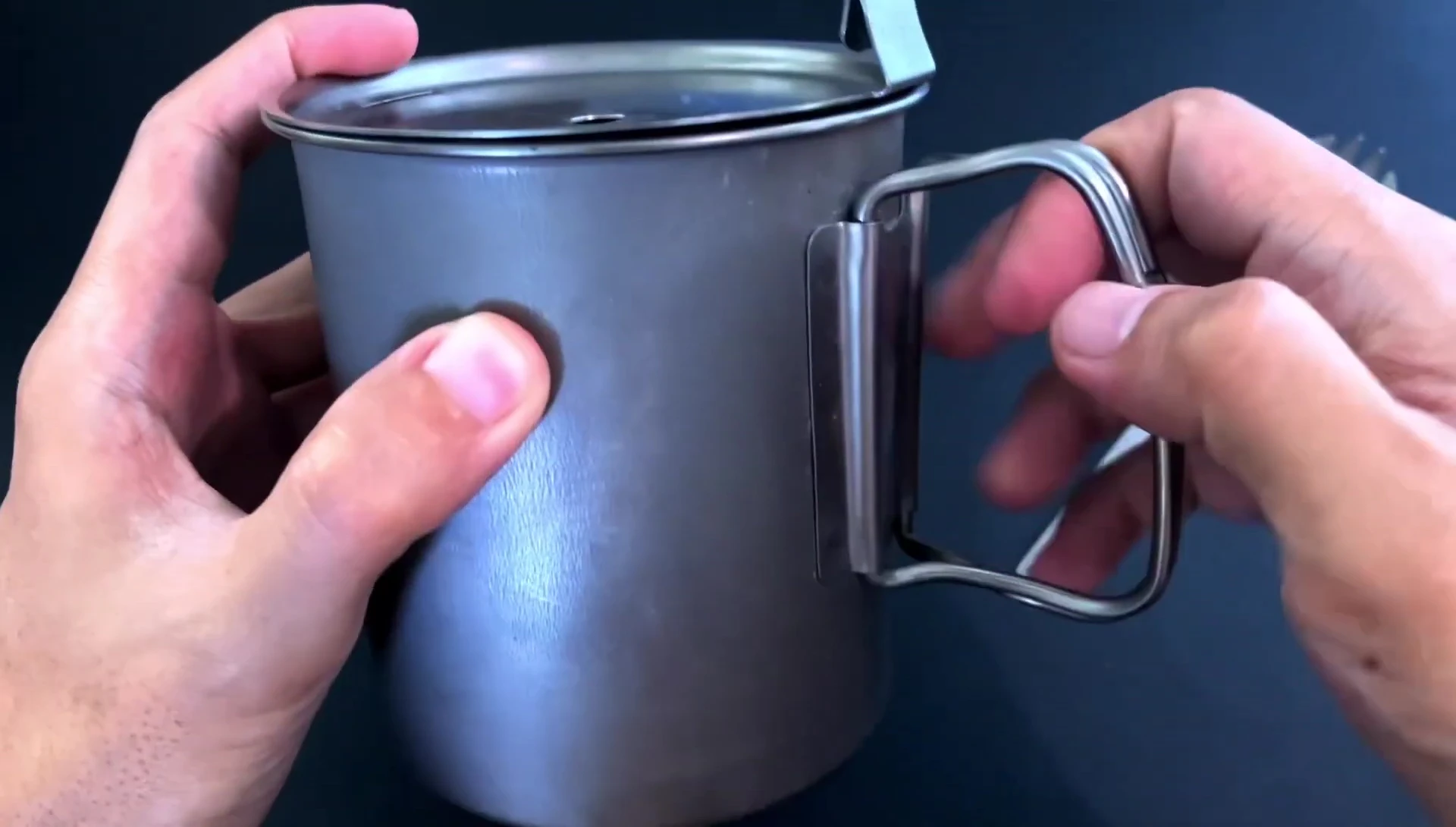 The Trek 700 mug lid showcasing the spout and tab.