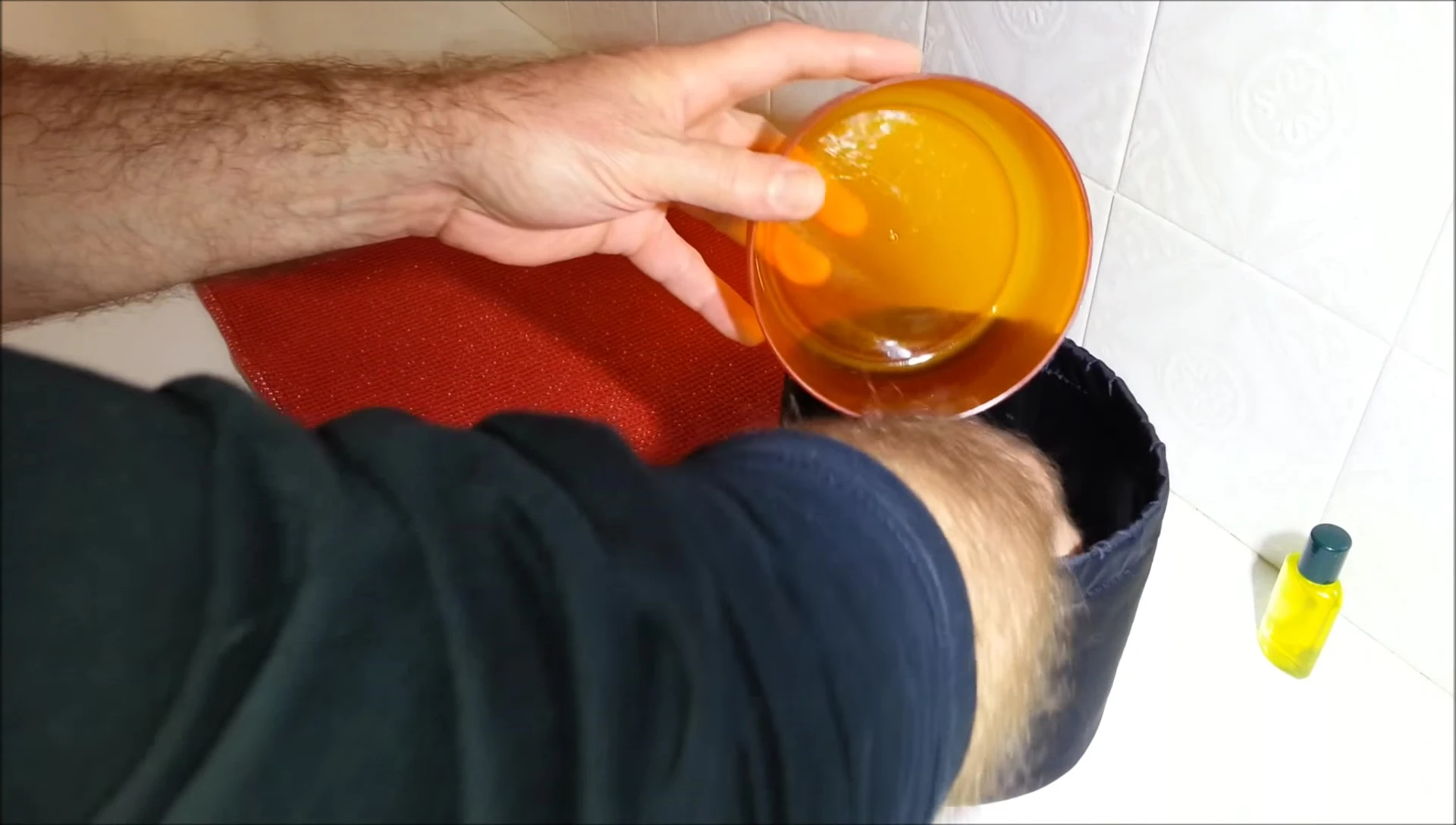 Washing dishes in the outer container.