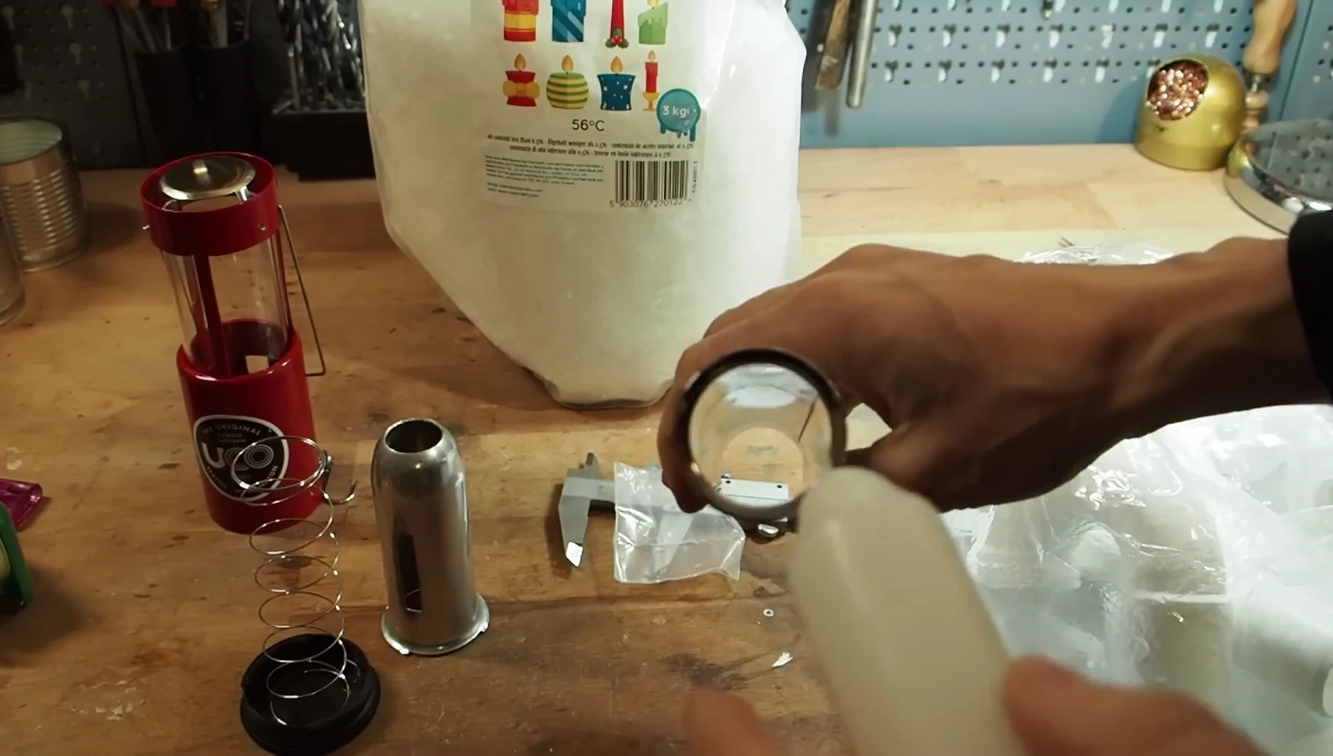 Testing the fit of the candle in the metal pipe