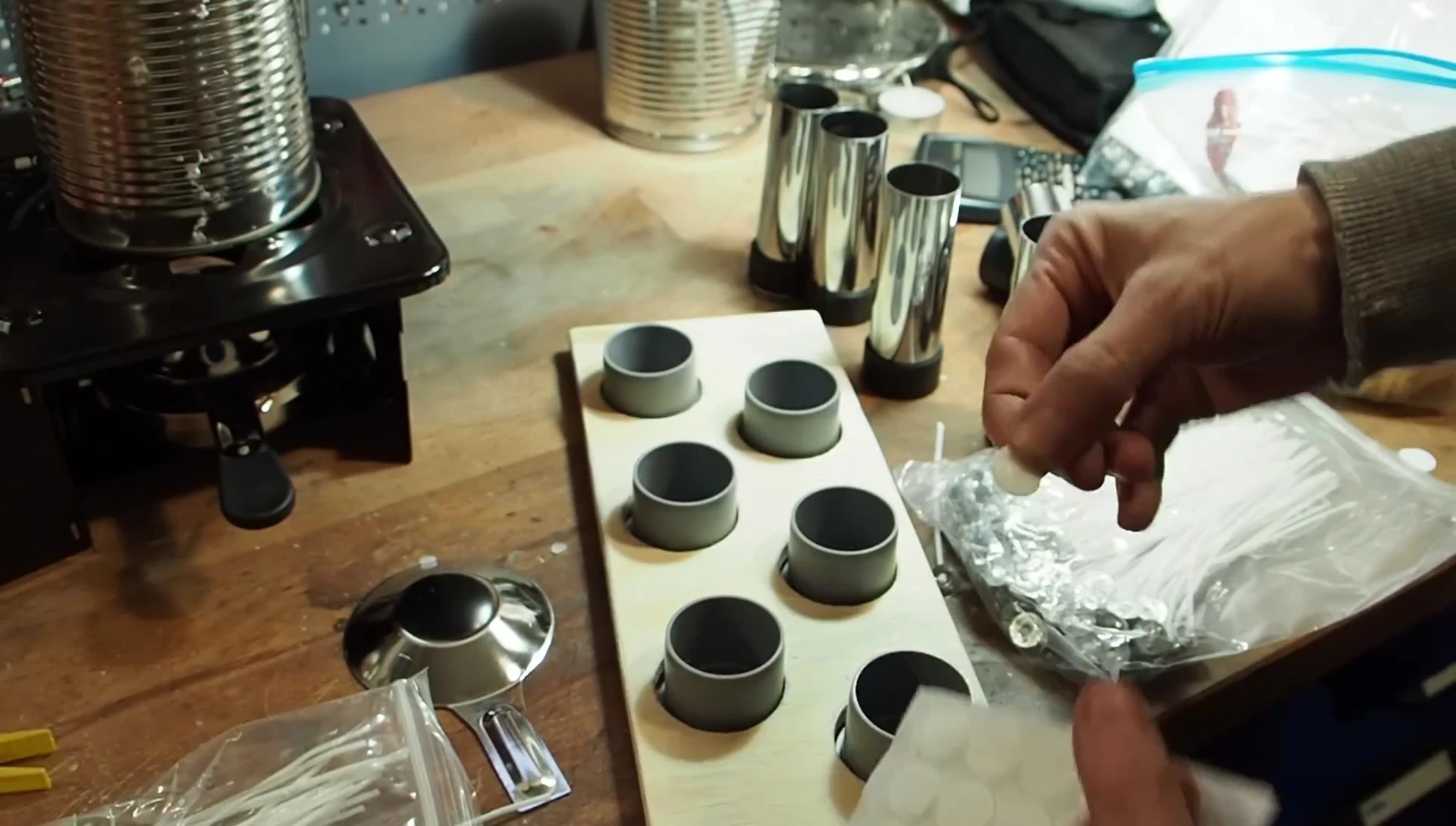 Attaching the wick to the mold using double-sided tape