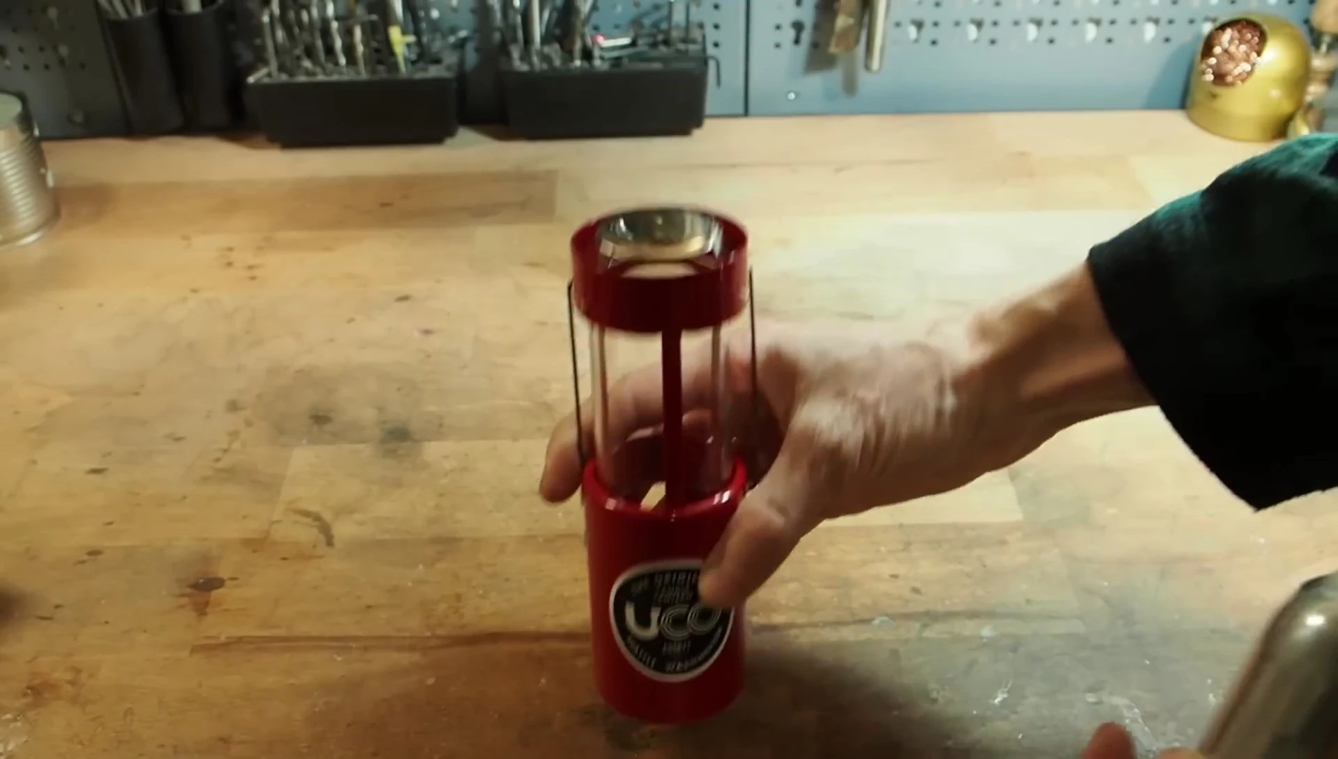 The speaker showing the price tag of the UCO Candle Lantern