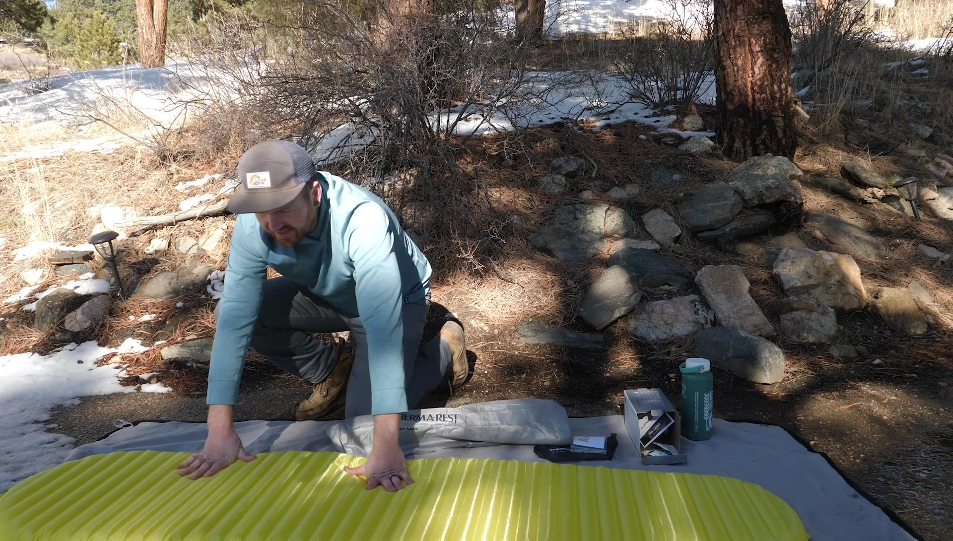 Person lying on the Thermarest NeoAir XLite sleeping pad