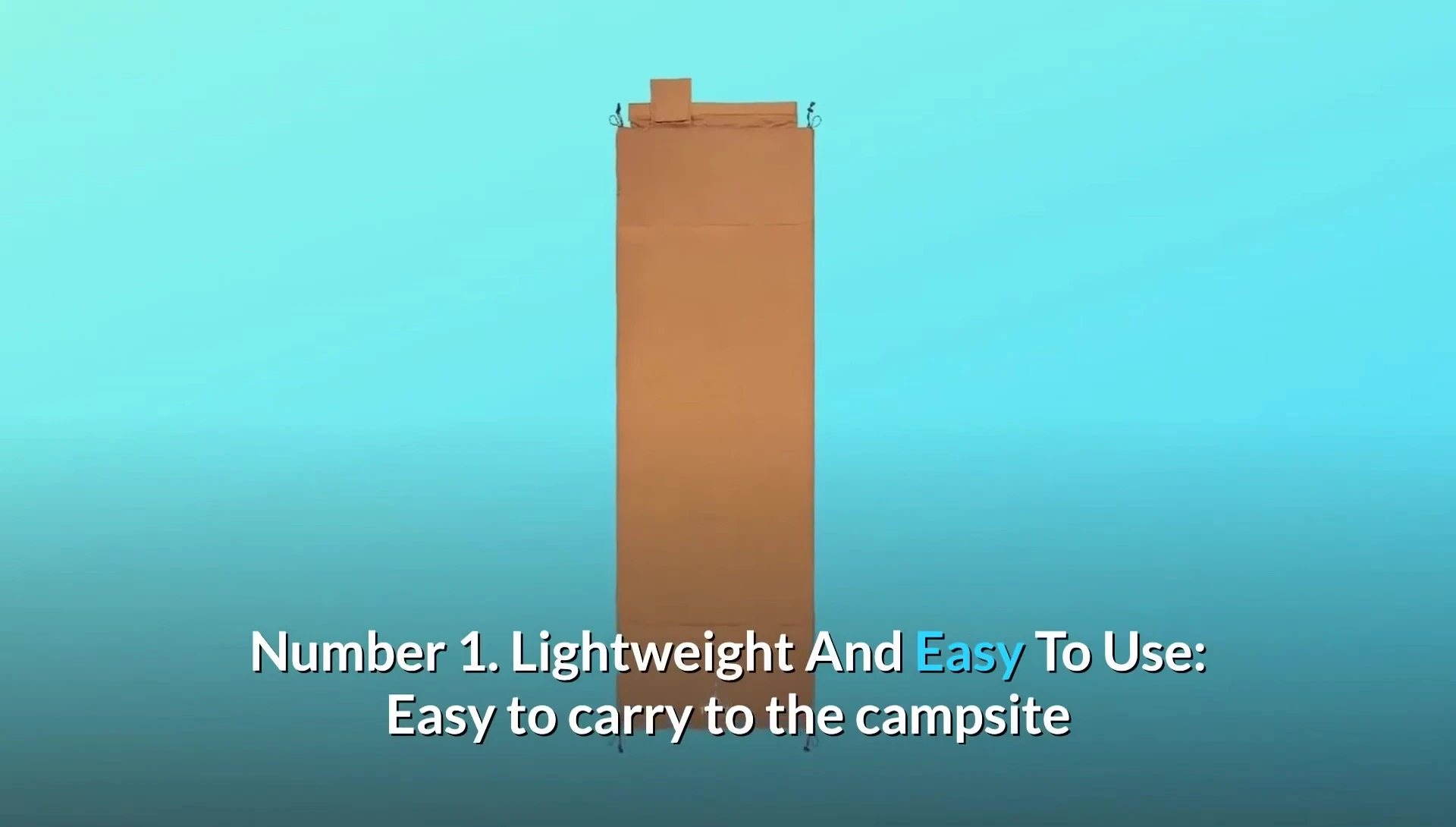 Someone demonstrating the ease of rolling and packing the camp pad using the built-in straps.