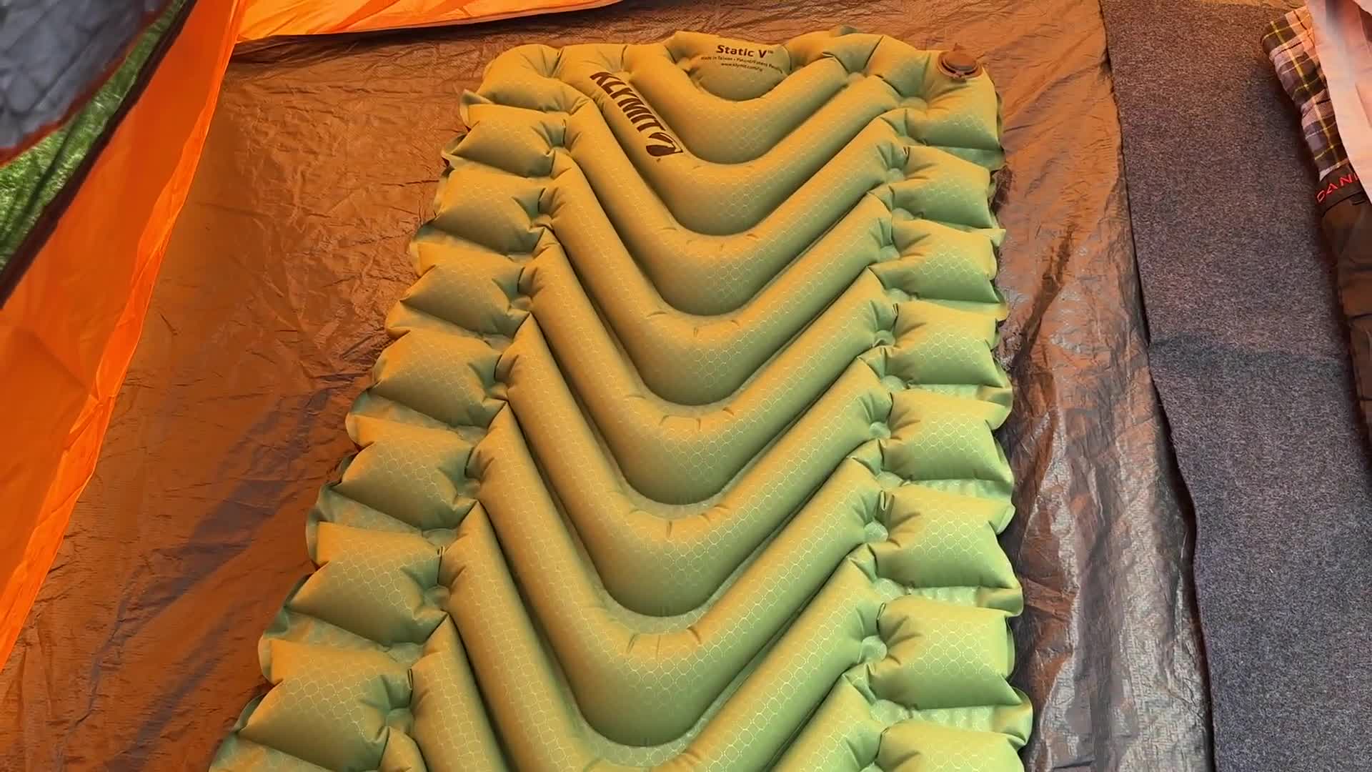 Close-up shot of the Klymit Static V sleeping pad's packed size and weight.