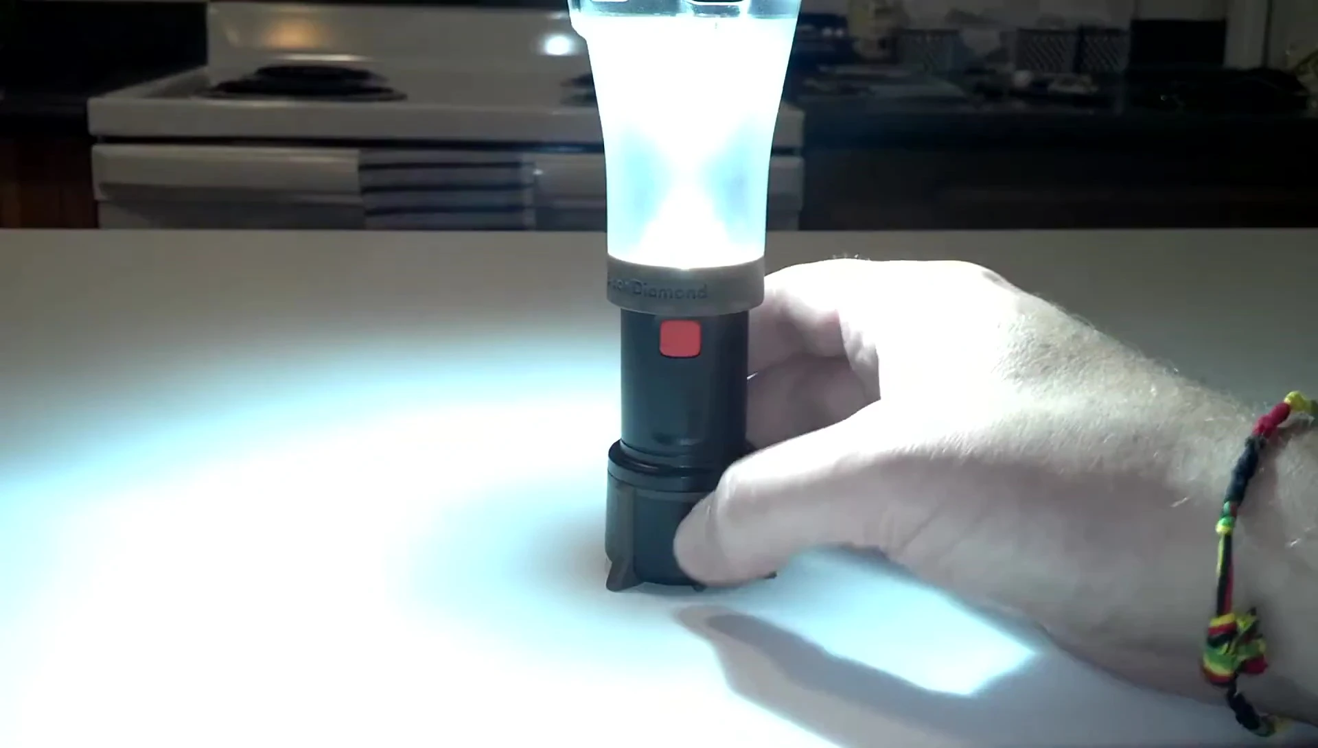 The Orbit lantern illuminated, showcasing its light output.