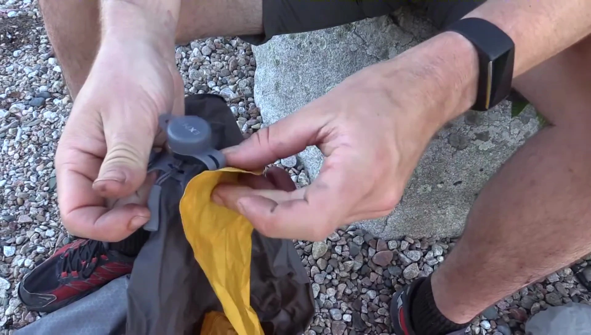 Connecting the inflation bag to the mat's valve.