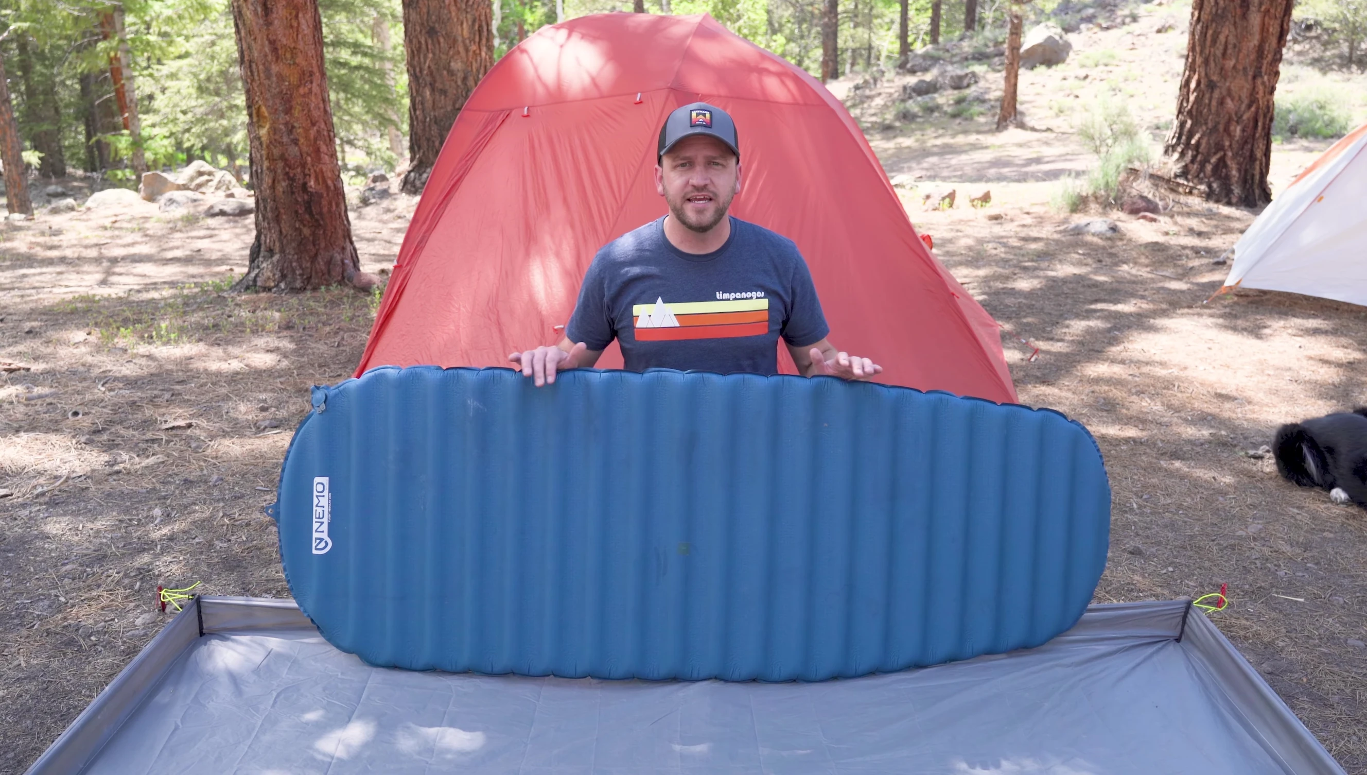 A self-inflating sleeping pad being demonstrated