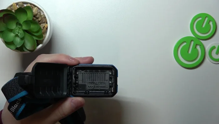 Insert the second and third batteries, ensuring correct polarity.
