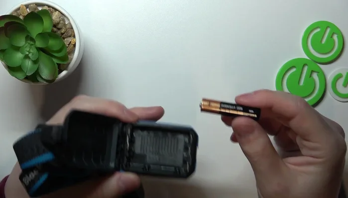 Insert the second and third batteries, ensuring correct polarity.