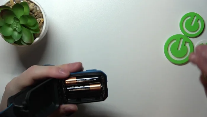 Insert the second and third batteries, ensuring correct polarity.