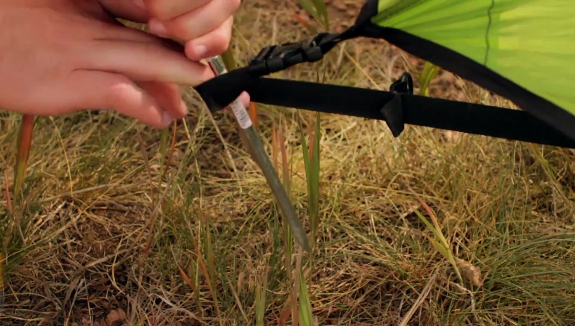 Illustrating the proper angle for driving tent stakes.