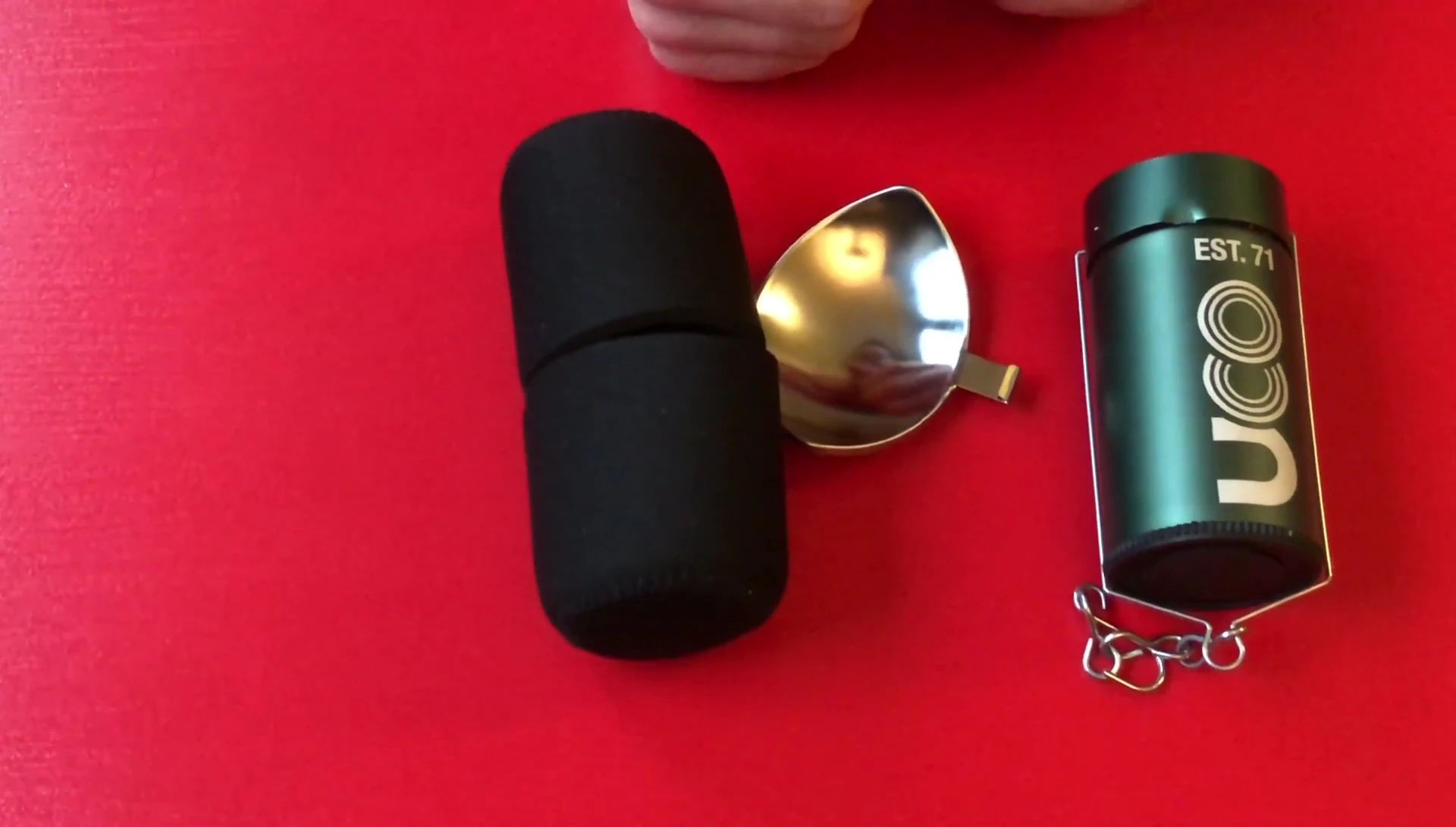 Close-up of the lantern in the reviewer's hand, showcasing its compact size.