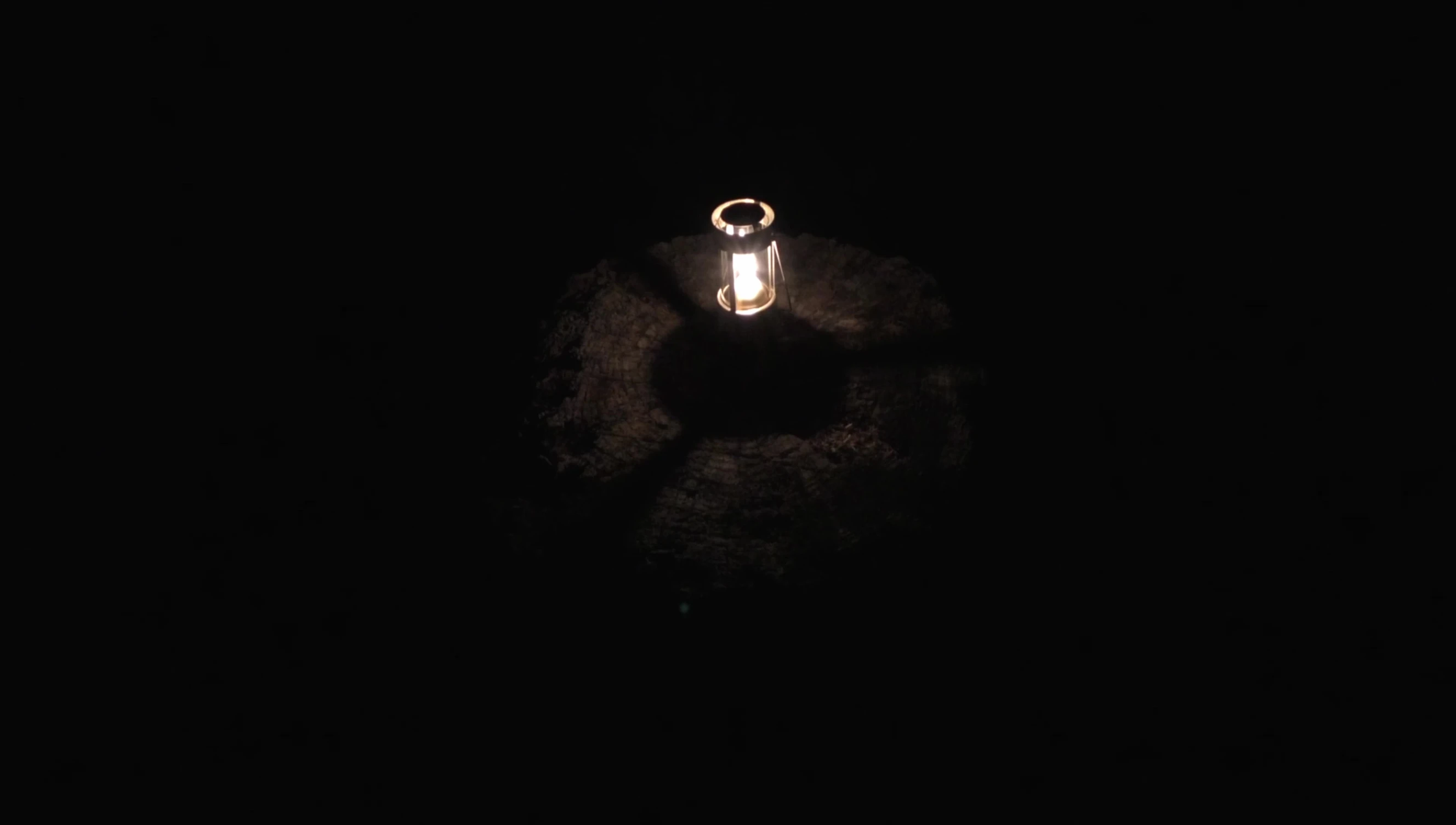 The lantern lit outdoors at night