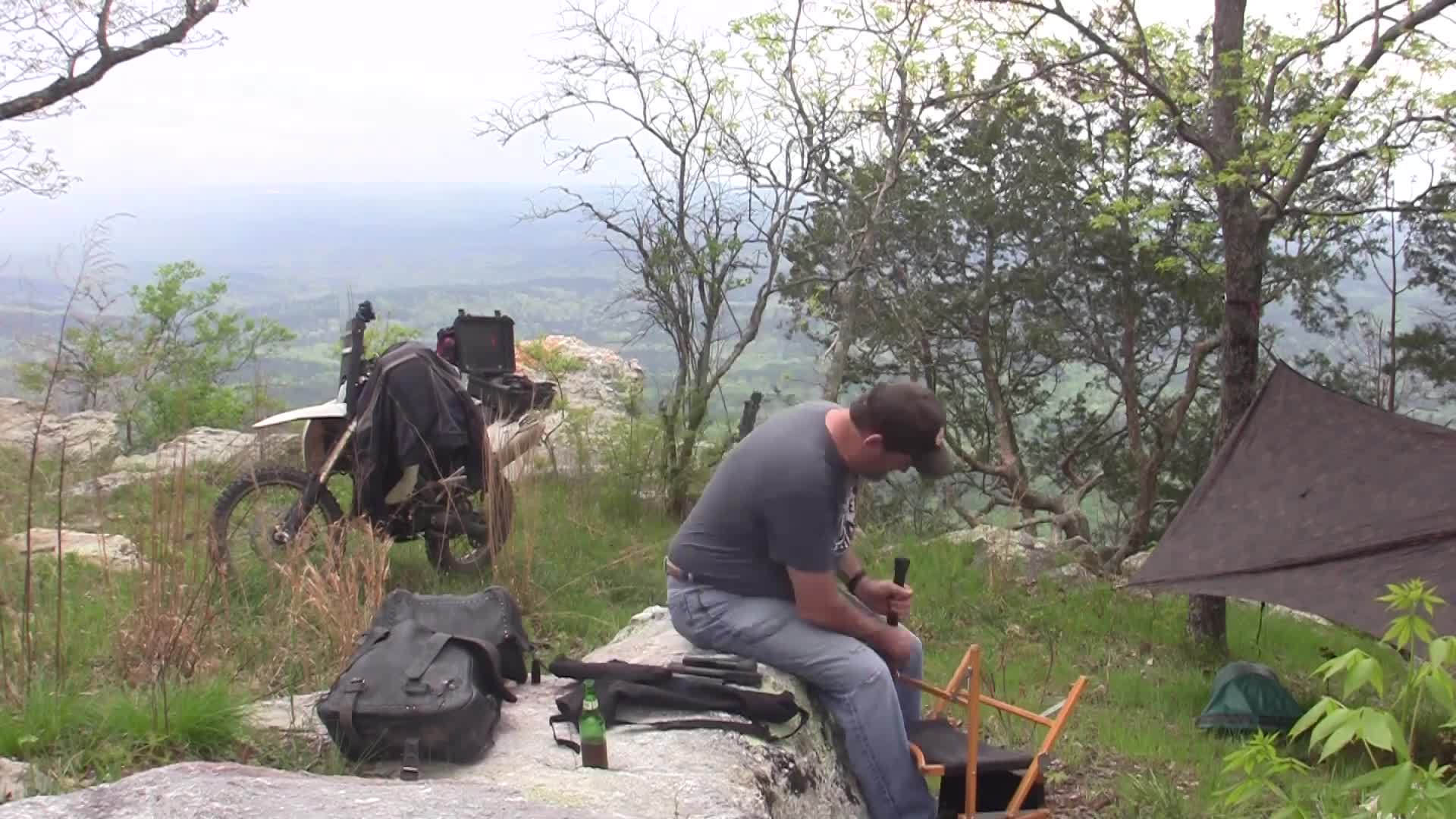 The narrator showing his motorcycle, highlighting space constraints.