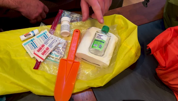 Toiletries: Pack essentials in a dry bag (toilet paper, hand sanitizer, trowel). Keep toothpaste and toothbrush separate in bear can due to scent.