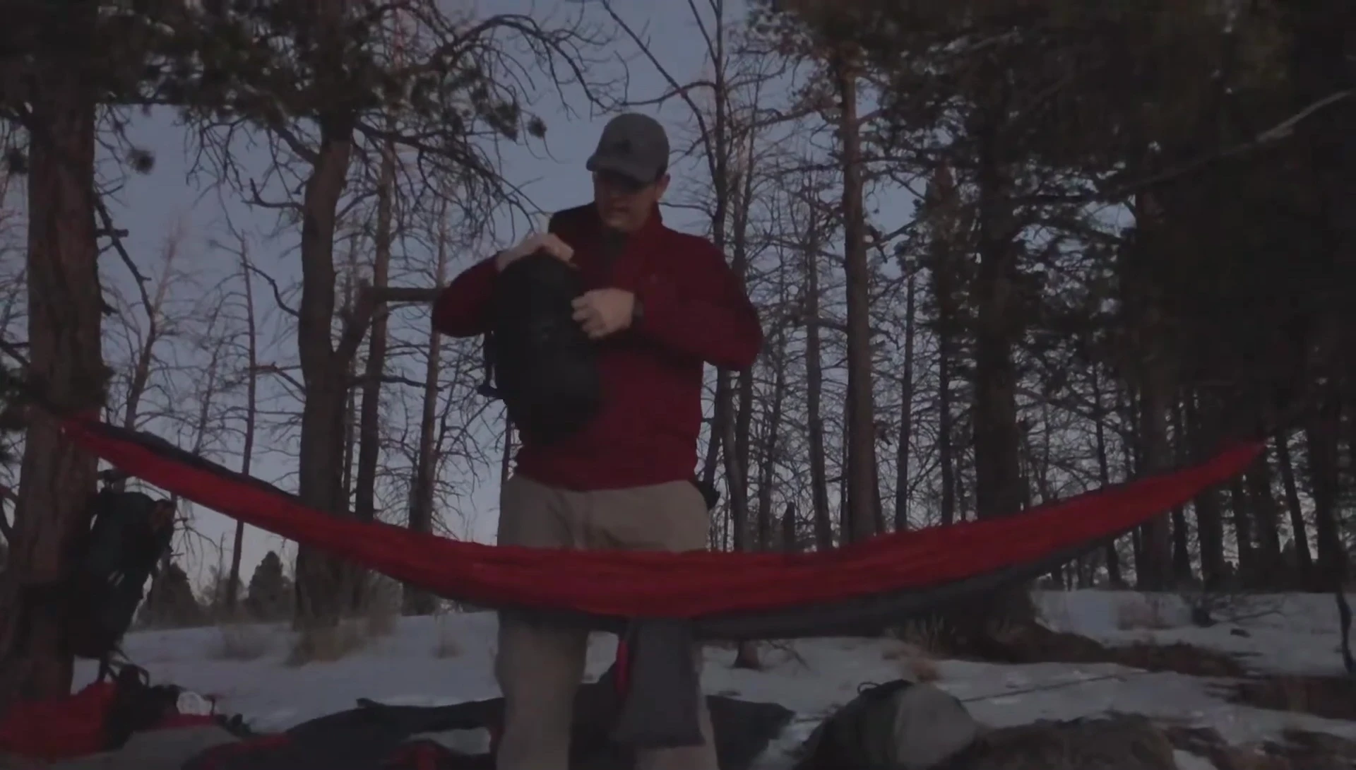 Setting up the sleeping bag inside the hammock.