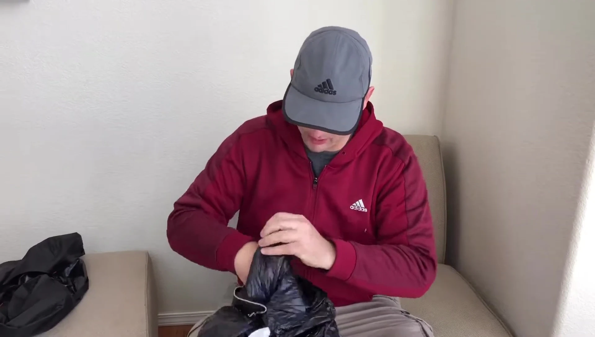 Highlighting the drawstrings at the bottom of the sleeping bag.