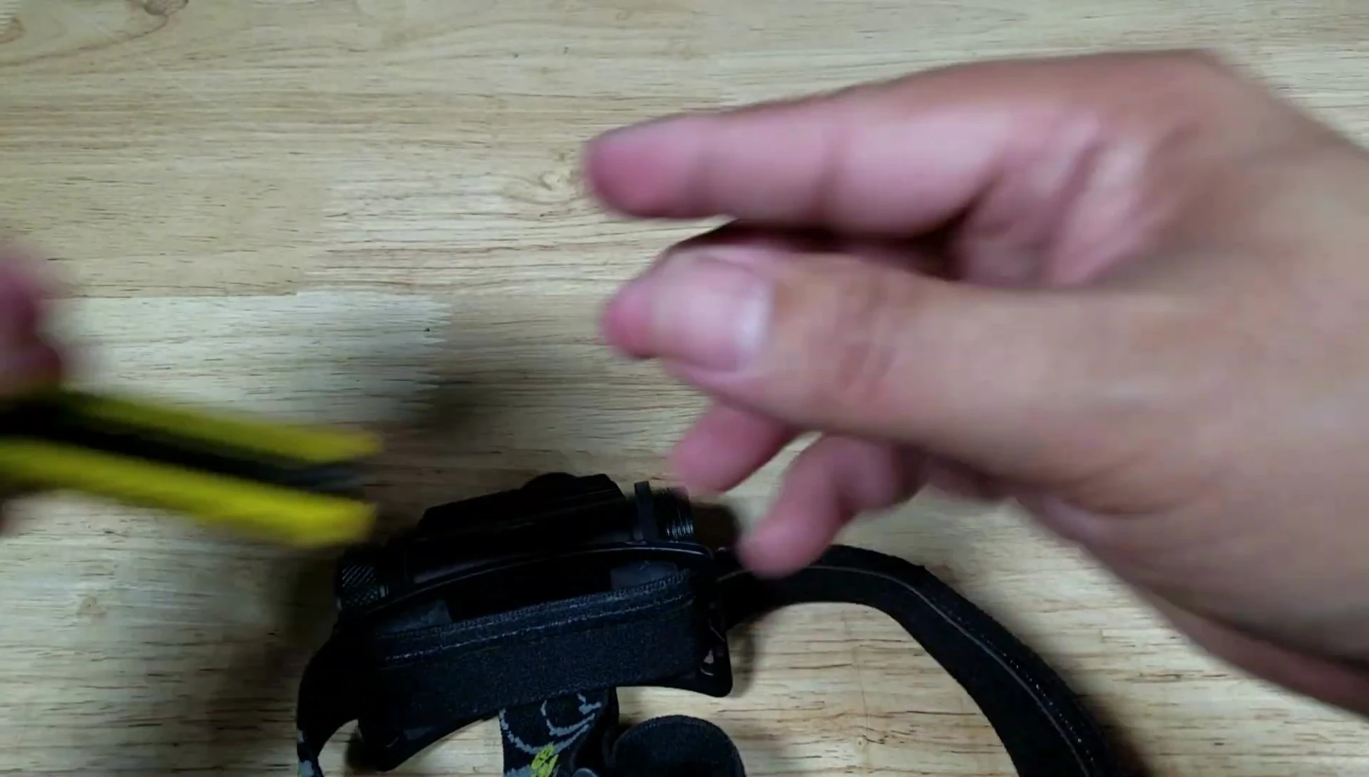 Headlamp with head strap attached
