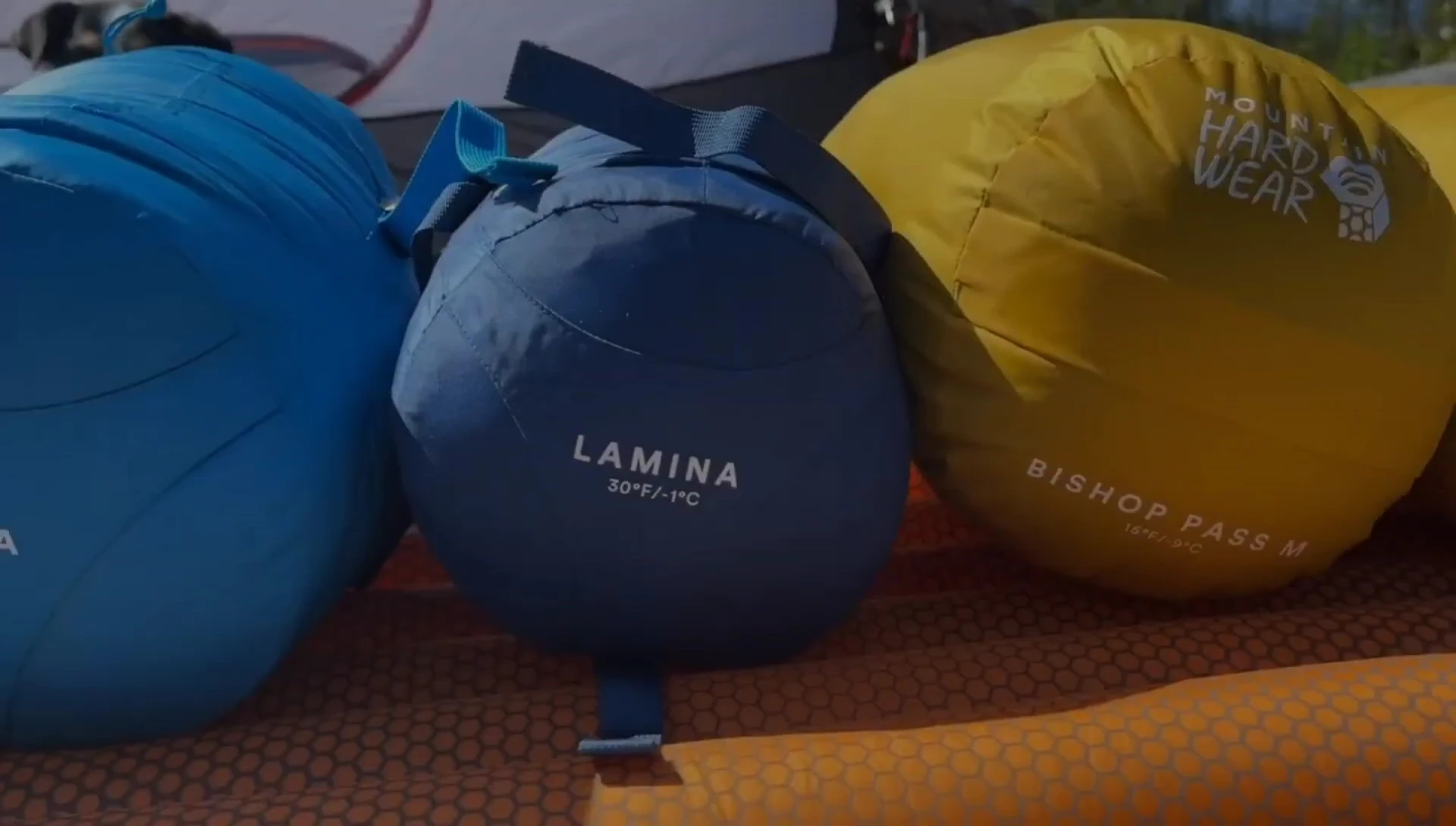 The Lamina sleeping bag shown, emphasizing its compact size.