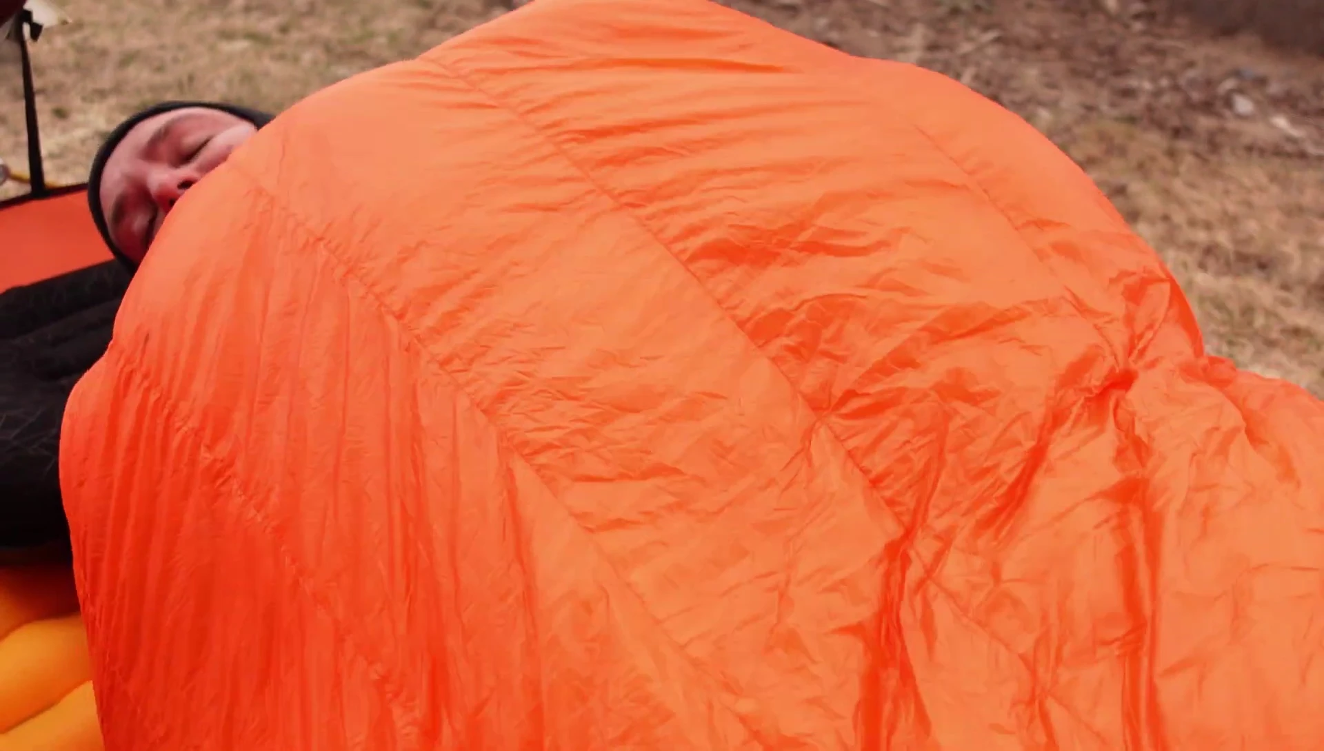 Person demonstrating freedom of movement with a quilt