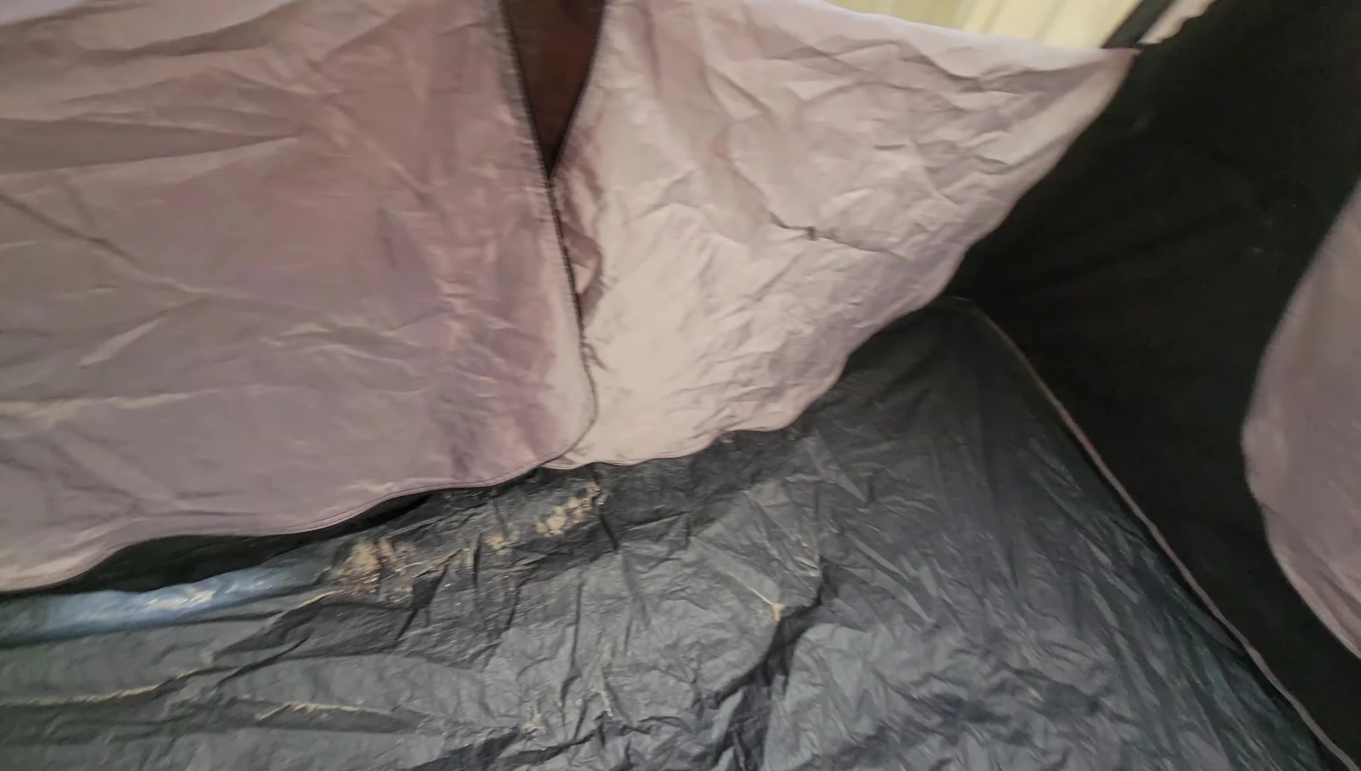 An overall shot of the tent's interior, showing ample room for gear and occupants.