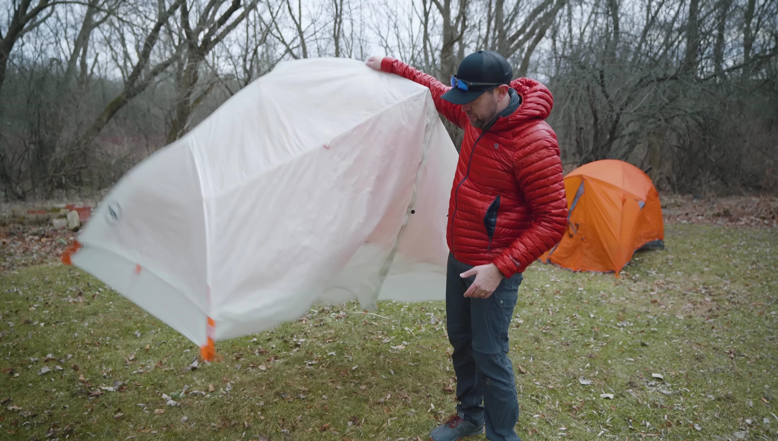 Person moving a freestanding tent