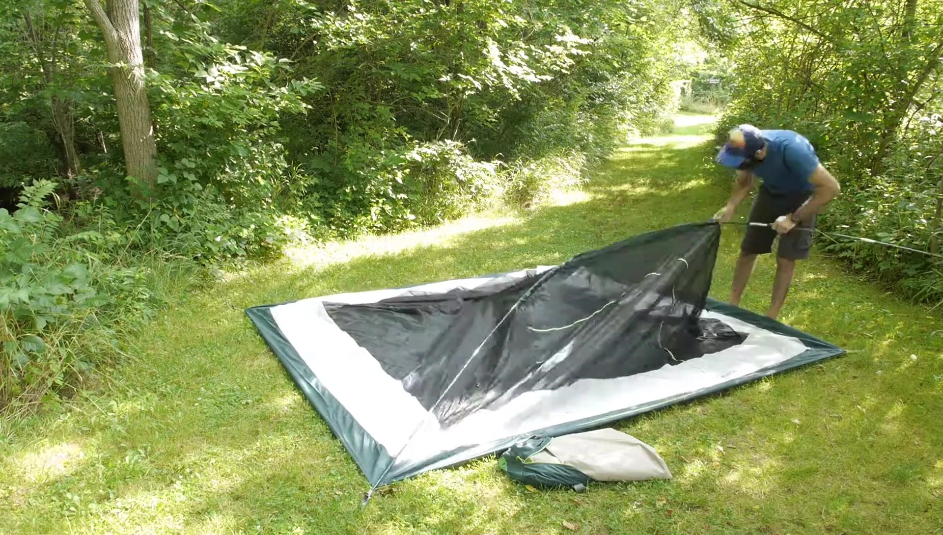 The tent poles forming an X-shape during setup.
