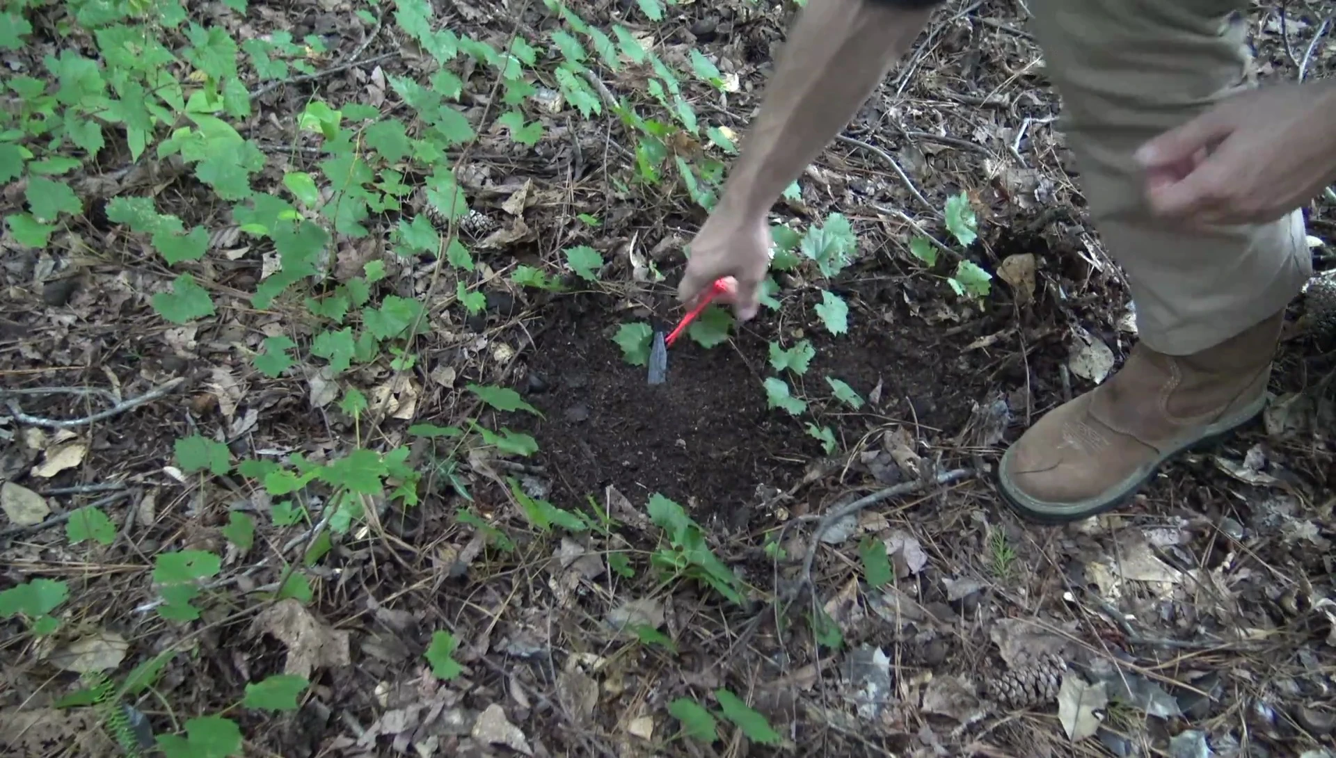 Driving the stake at a 45-degree angle into soft ground