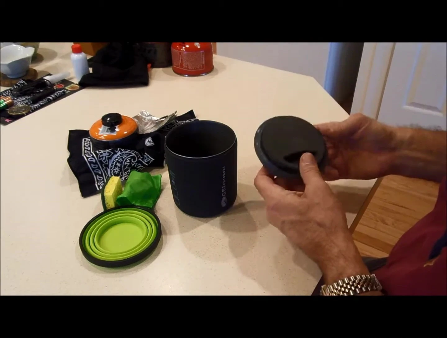 The lid demonstrating the sippy-cup functionality.