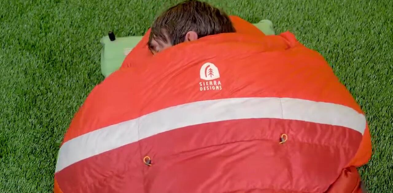 Close-up shot highlighting the integrated comforter and its adaptability.
