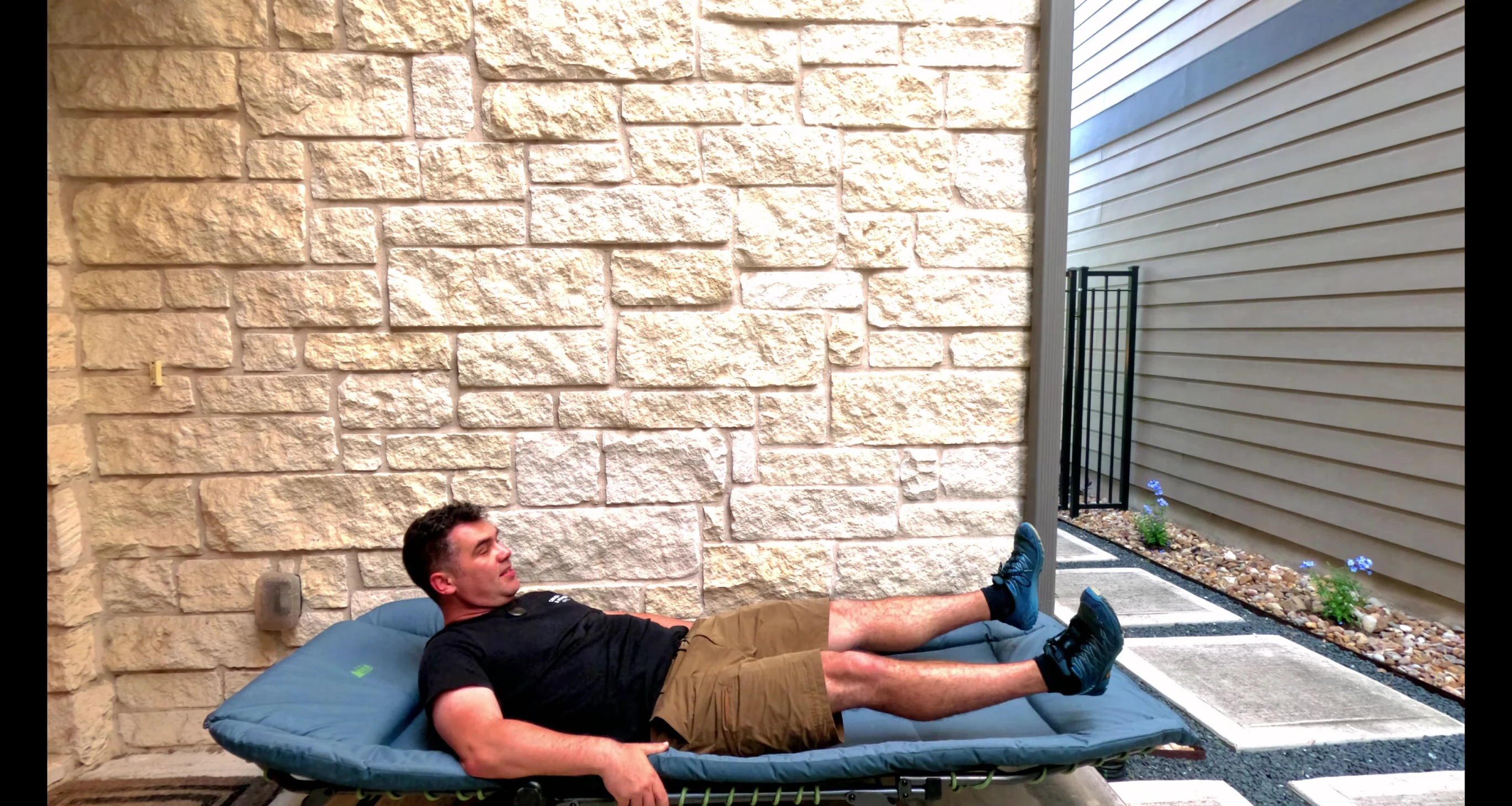 The reviewer testing the cot's standard mode comfort.