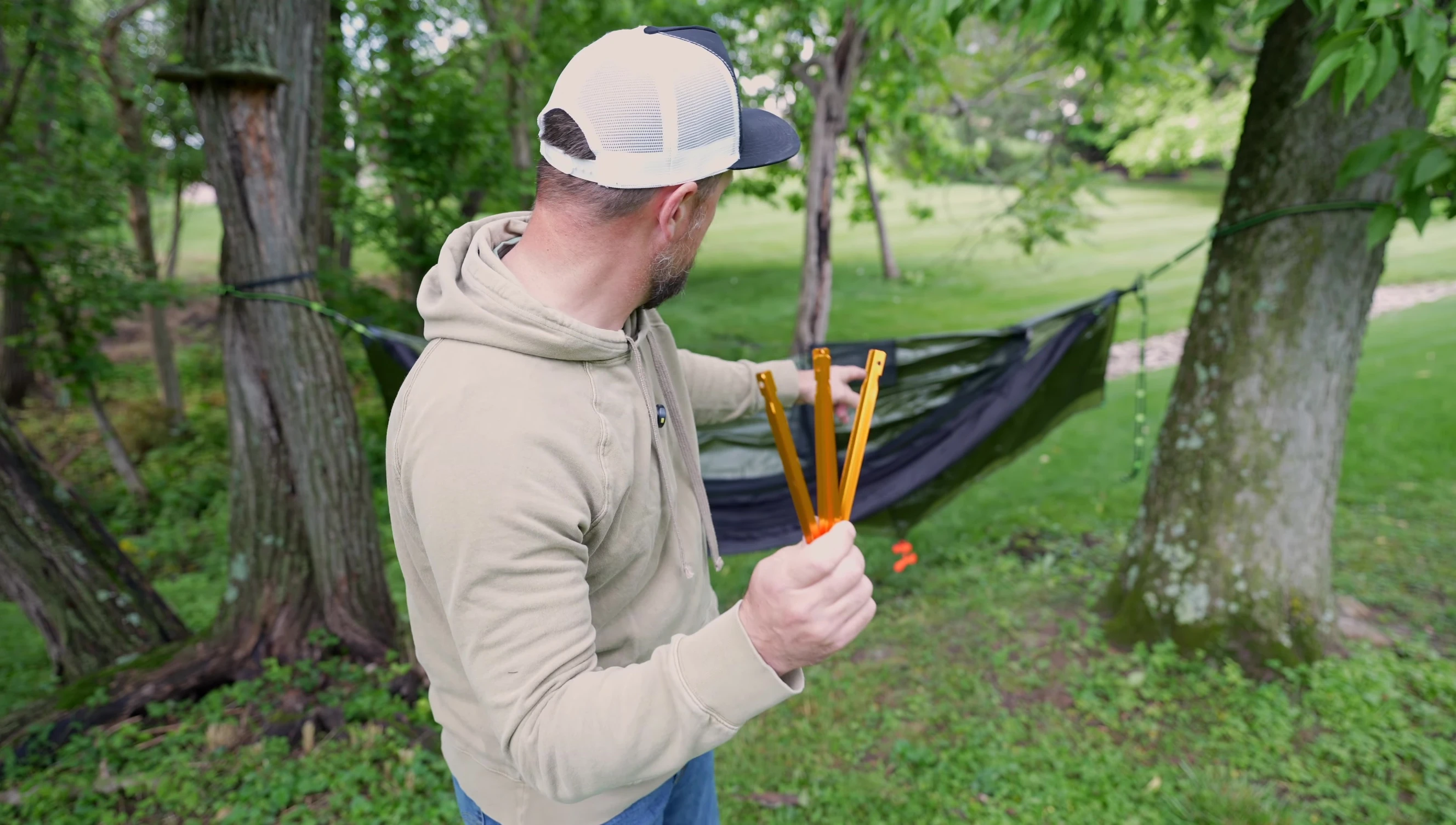 Staking down the corners of the rainfly.