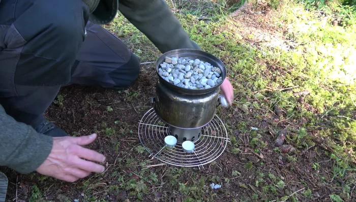 Use a small wire or similar object to keep the pot handle away from the candle flames.