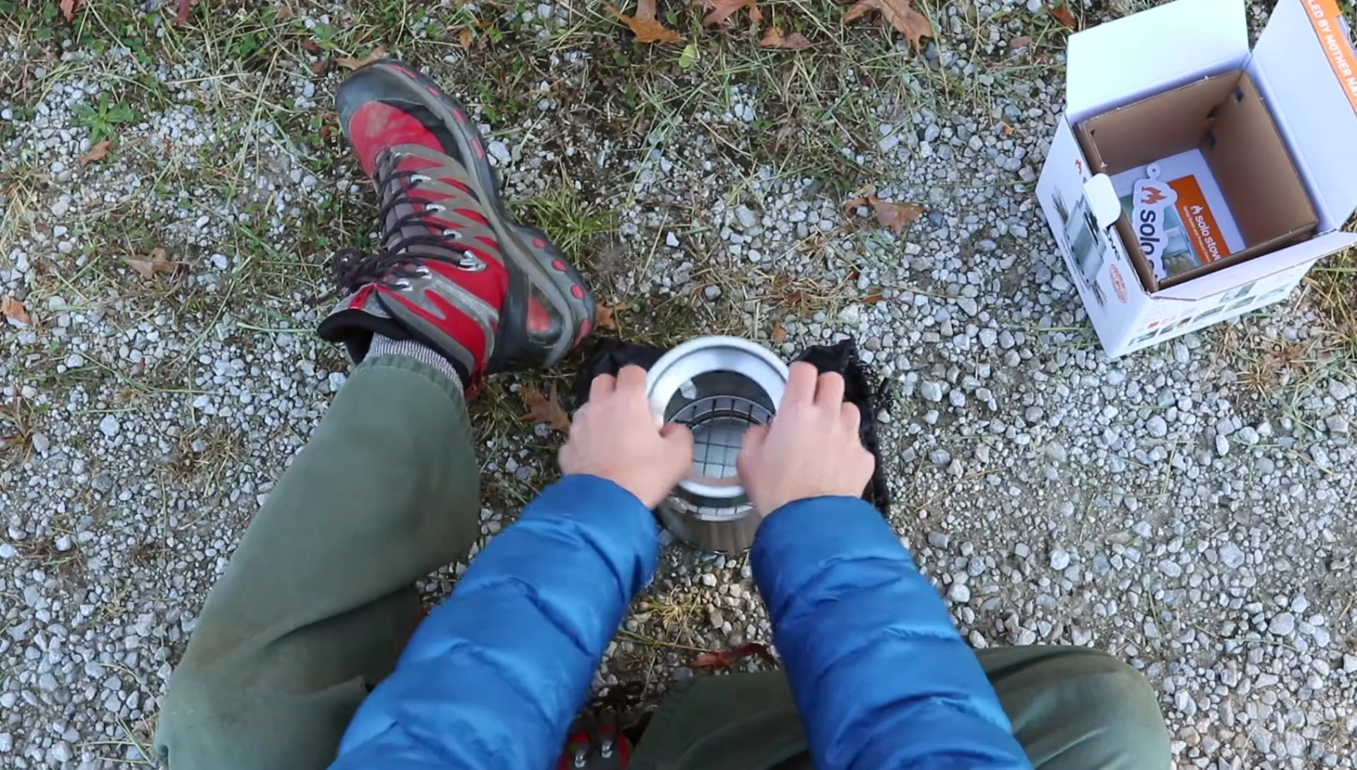 The stove top being flipped up to demonstrate its use.