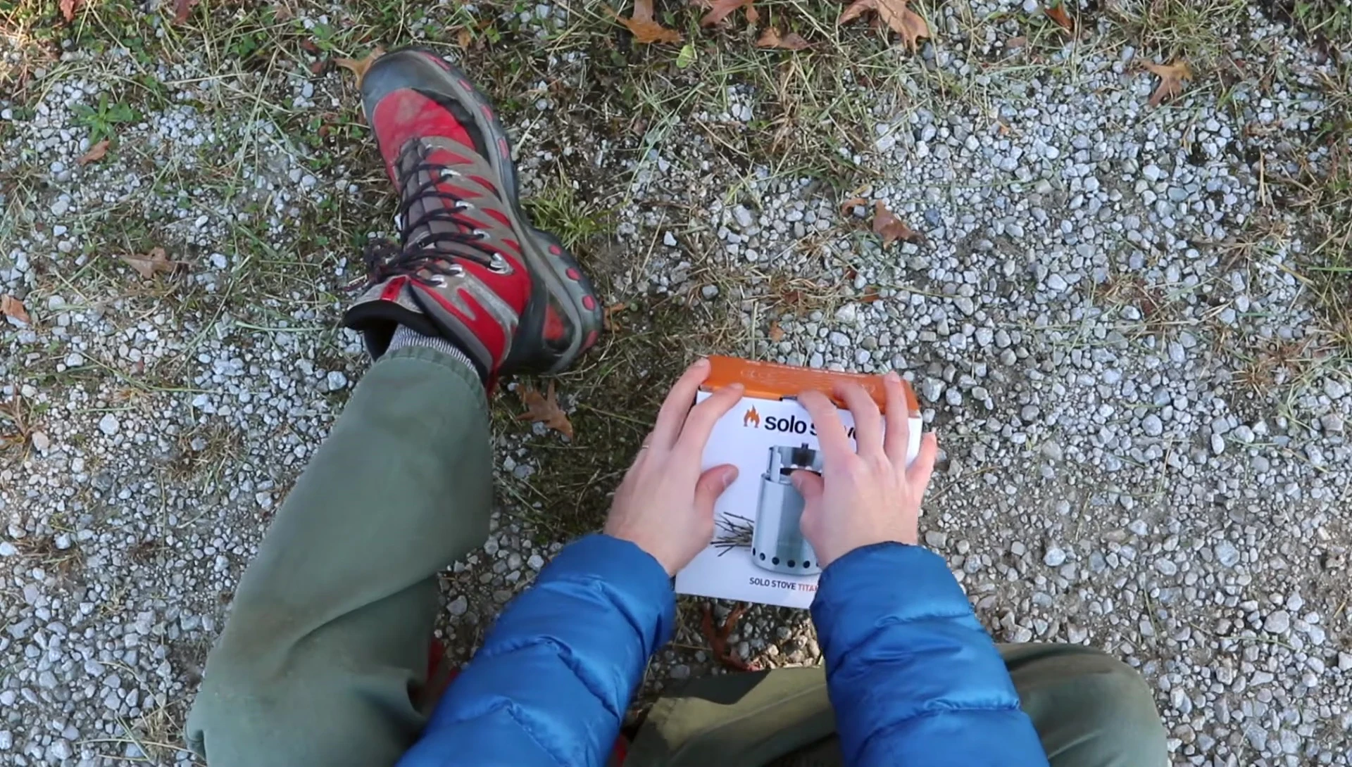 The Solo Stove Titan box being opened, showing the contents.
