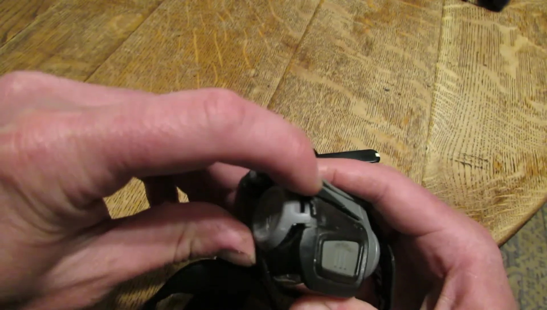 Several Princeton Tec Remix headlamps are shown, highlighting the broken battery clips.