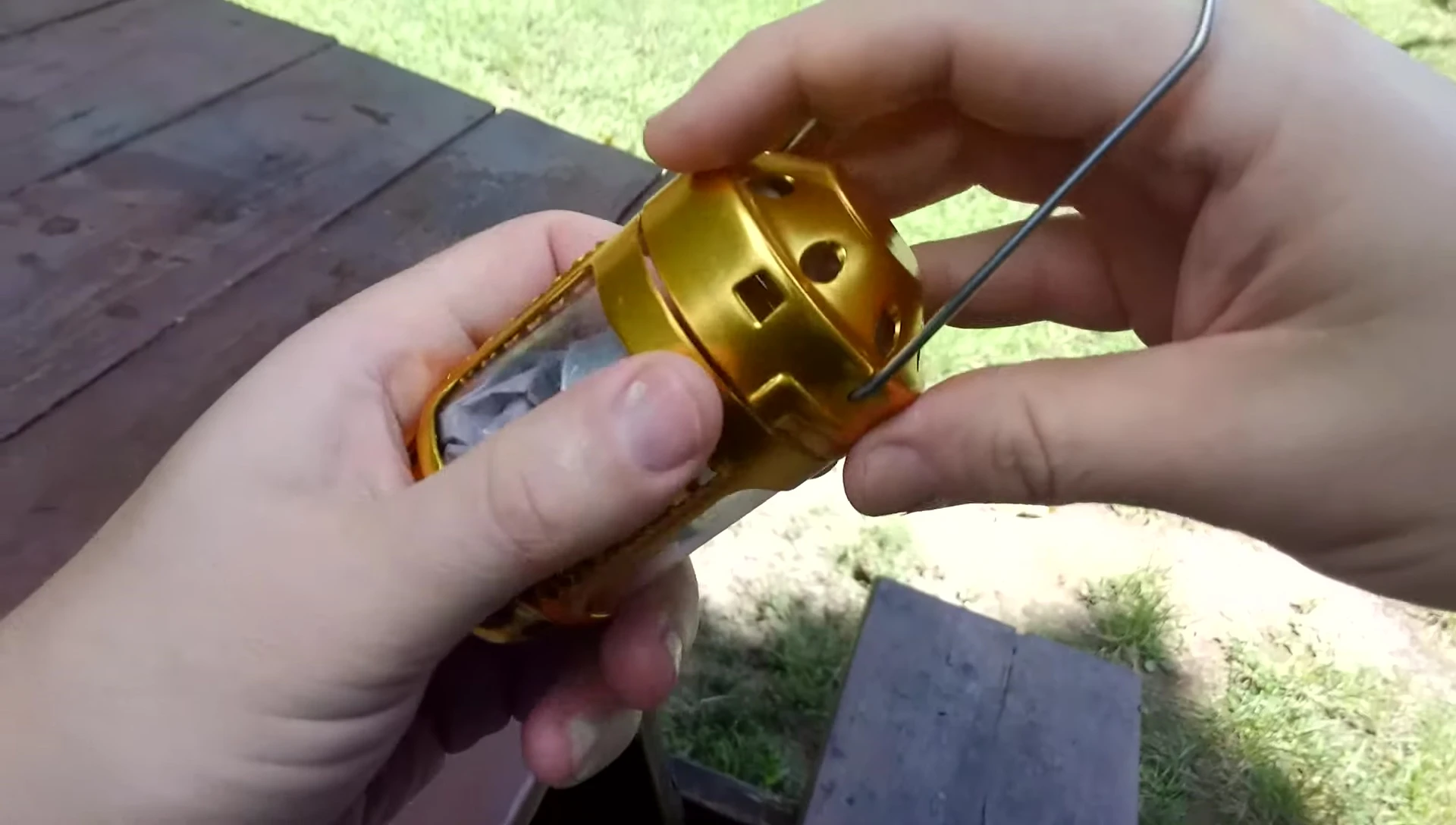 Demonstrating the lantern's twist-on mechanism.