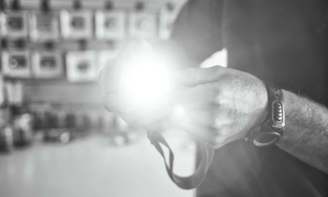 Person using the headlamp during an outdoor activity.
