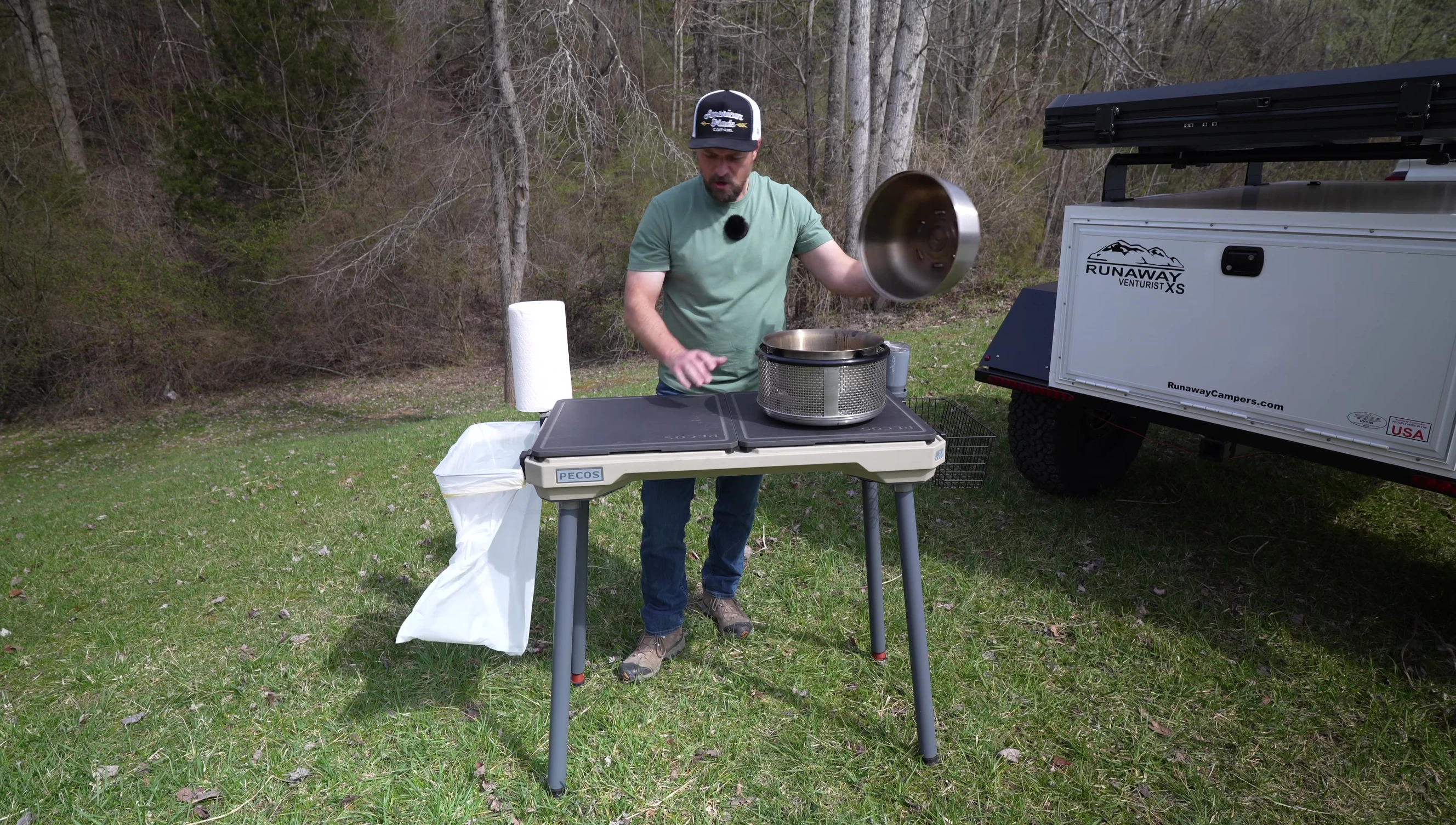 Grill placed on top of the heat shield on the table.