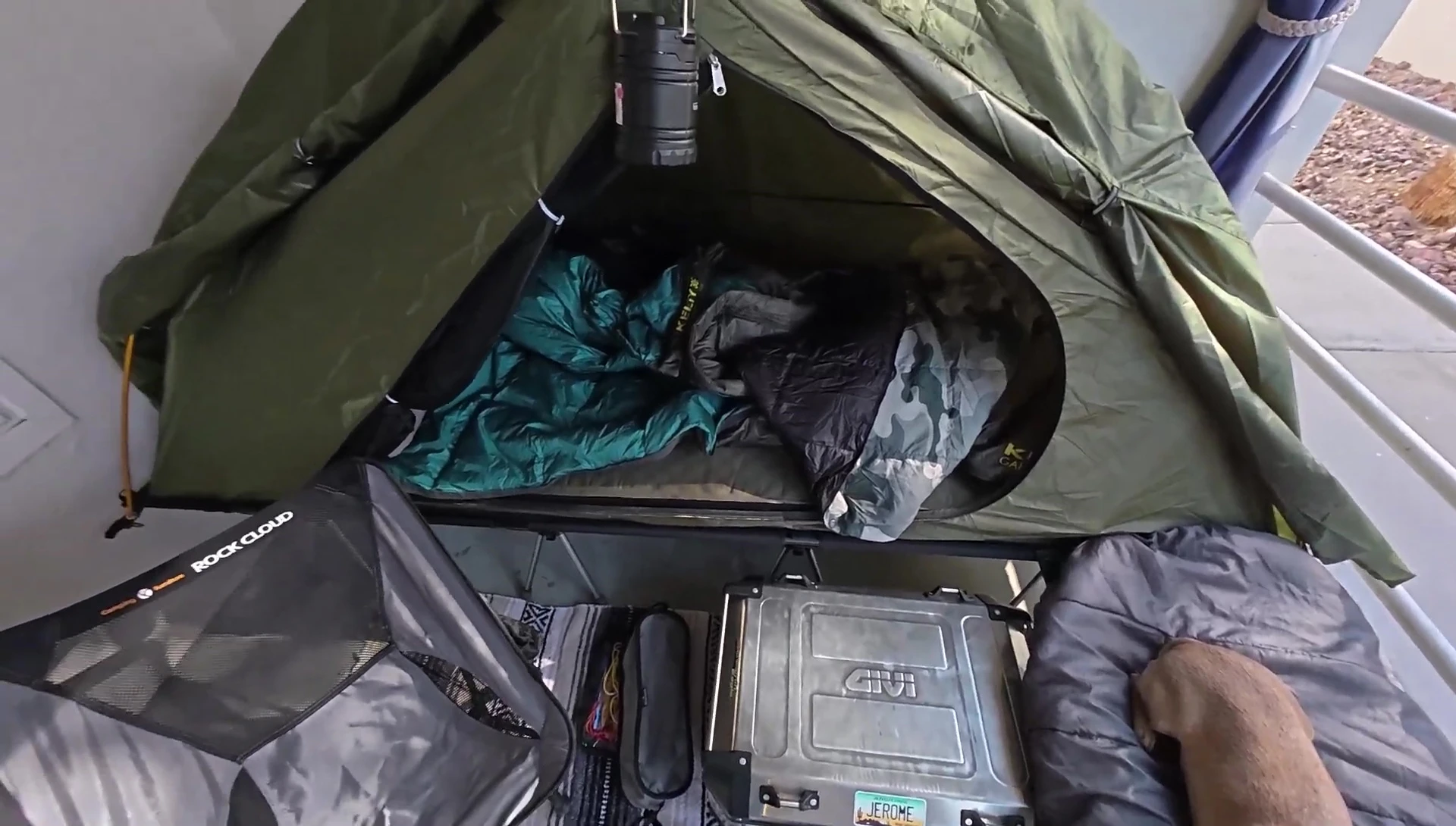 The speaker and his dog relaxing in the set-up cot tent.