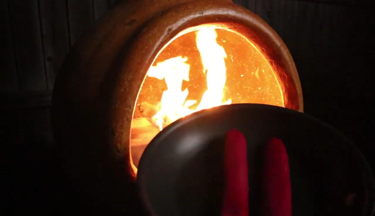 Preparing the simple meal on a portable stove.