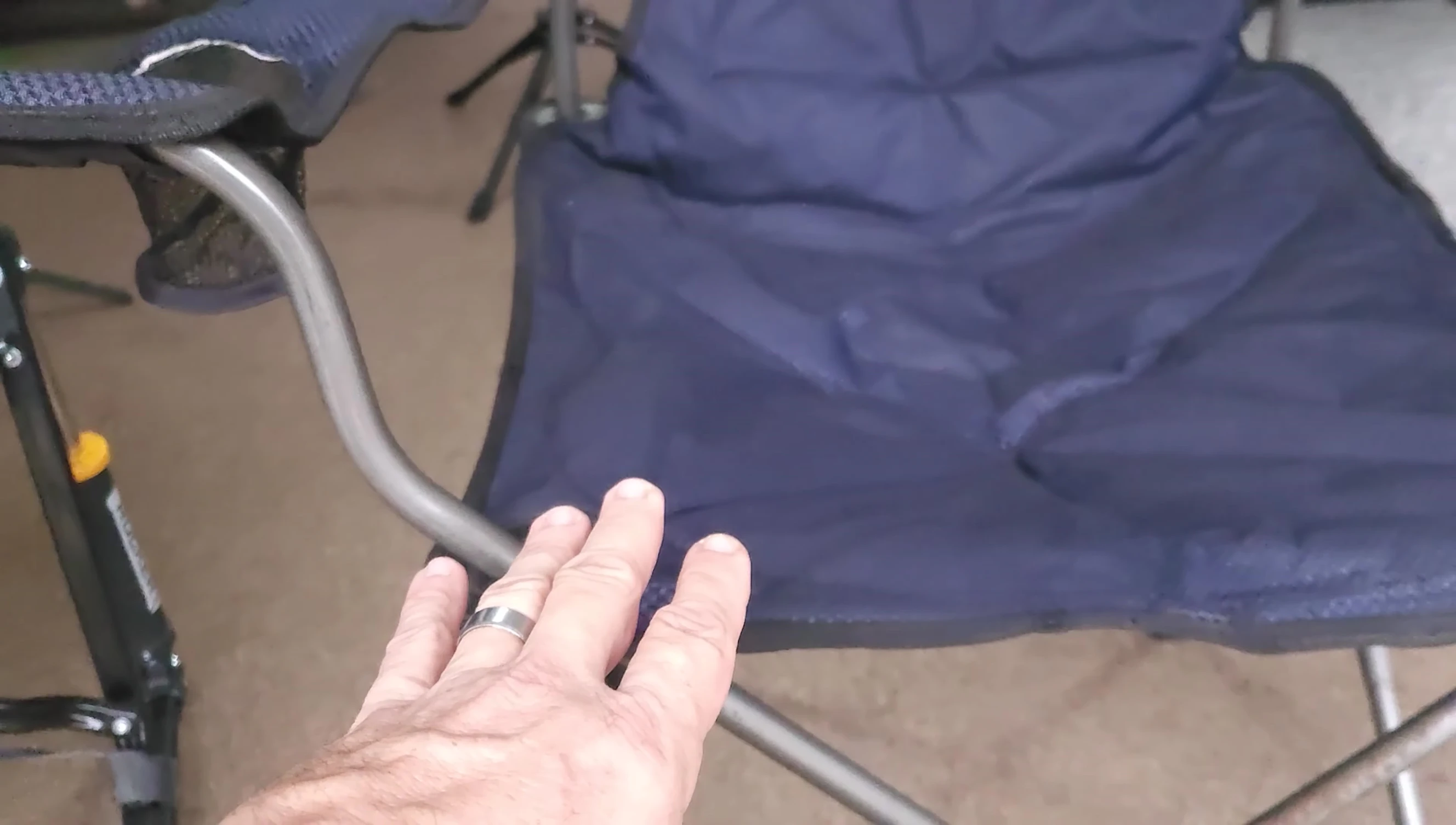 Close-up on the leg support area of another camping chair showing pressure point