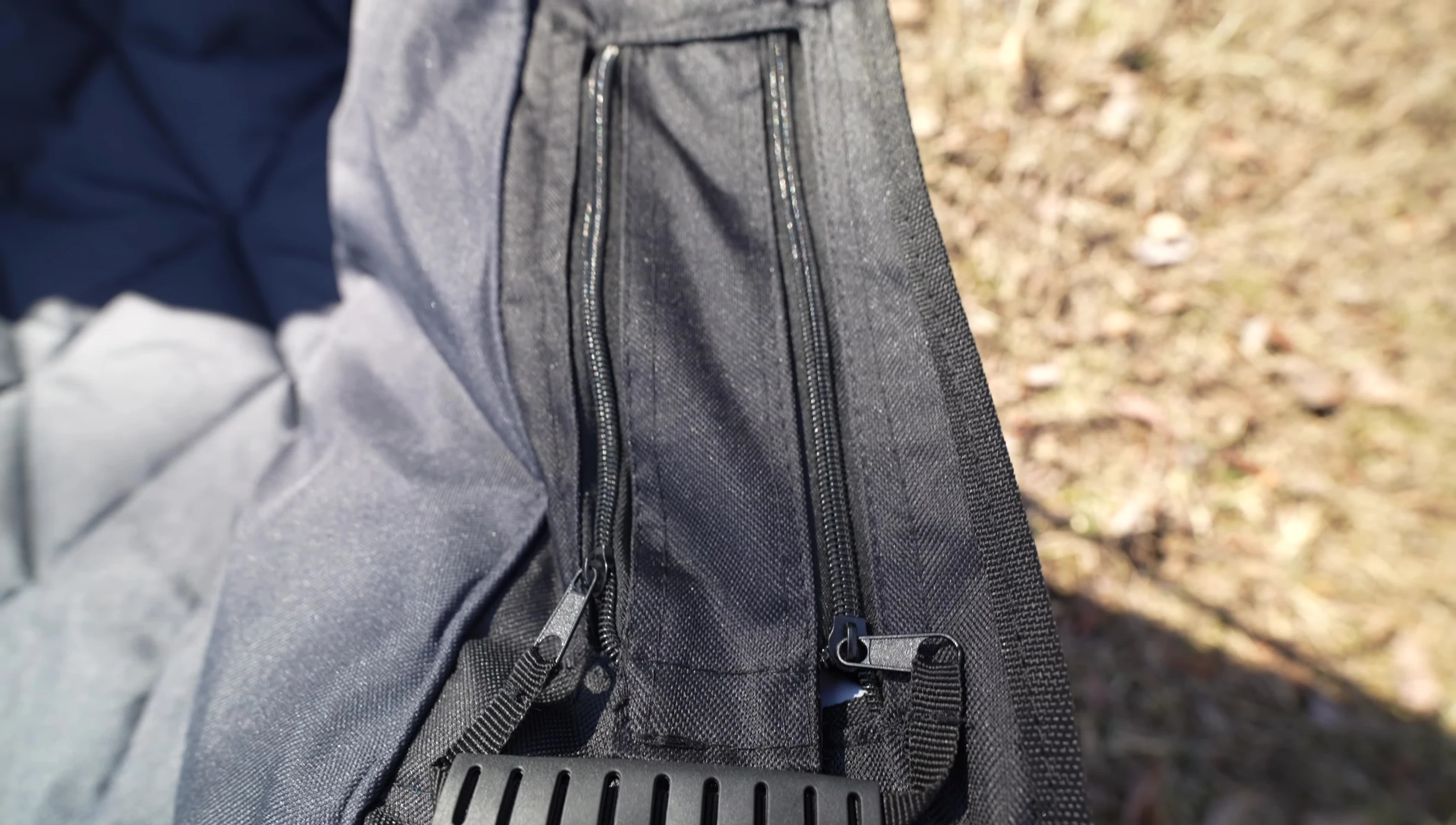 The reviewer demonstrating the chair's built-in cooler.