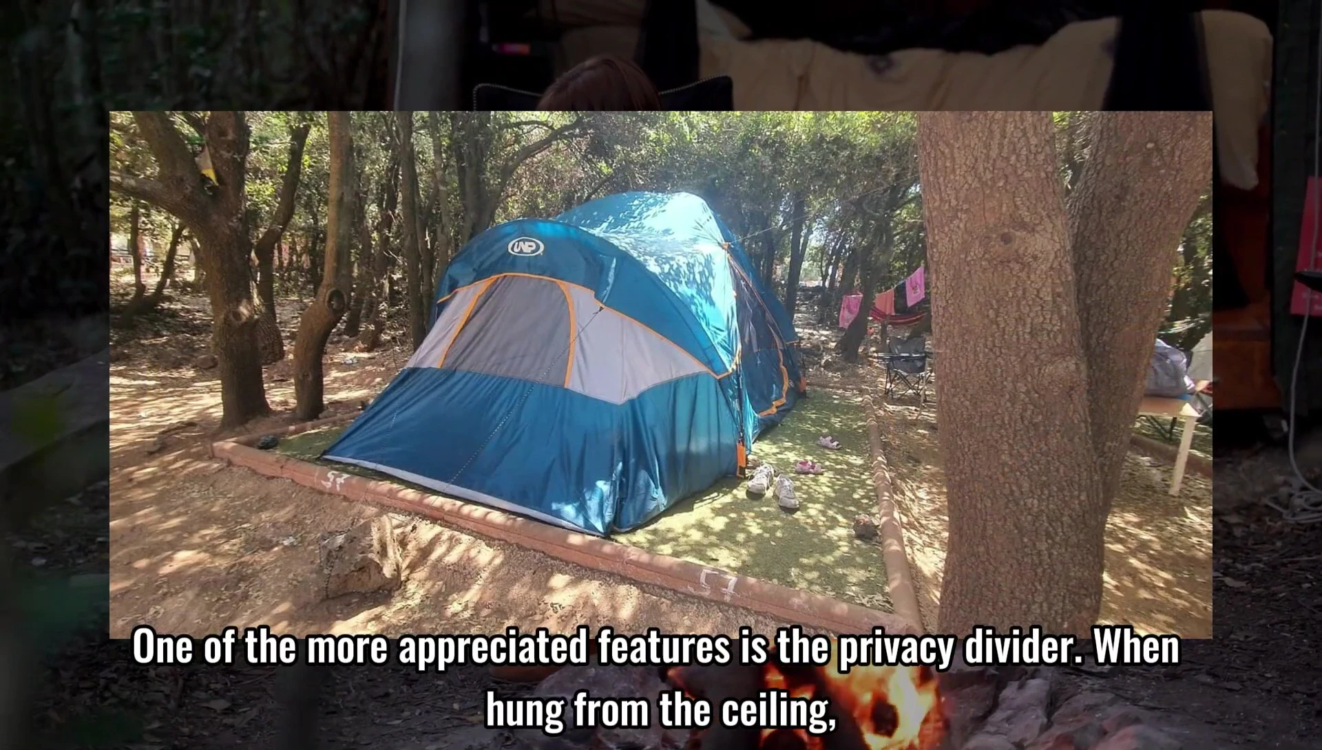 Image displaying the privacy divider hung inside the tent.