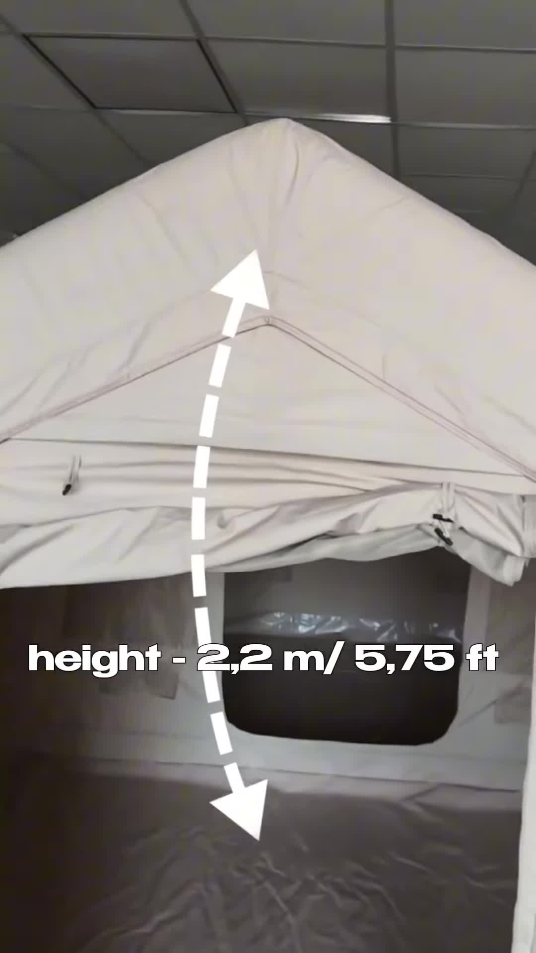 Close-up shot emphasizing the tent's size and weight