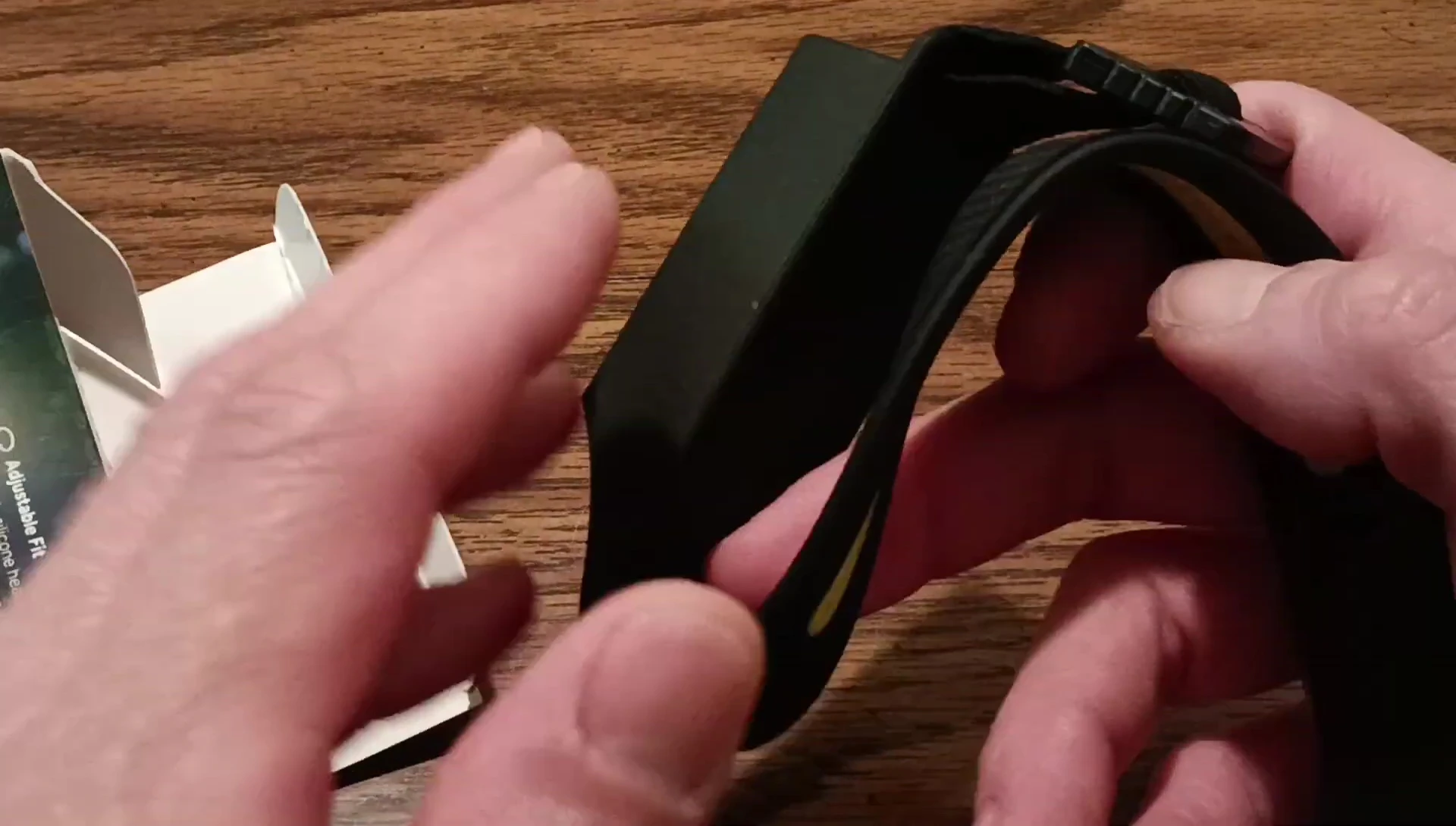 Unboxing the headlamp, showing the headlamp and charging cable